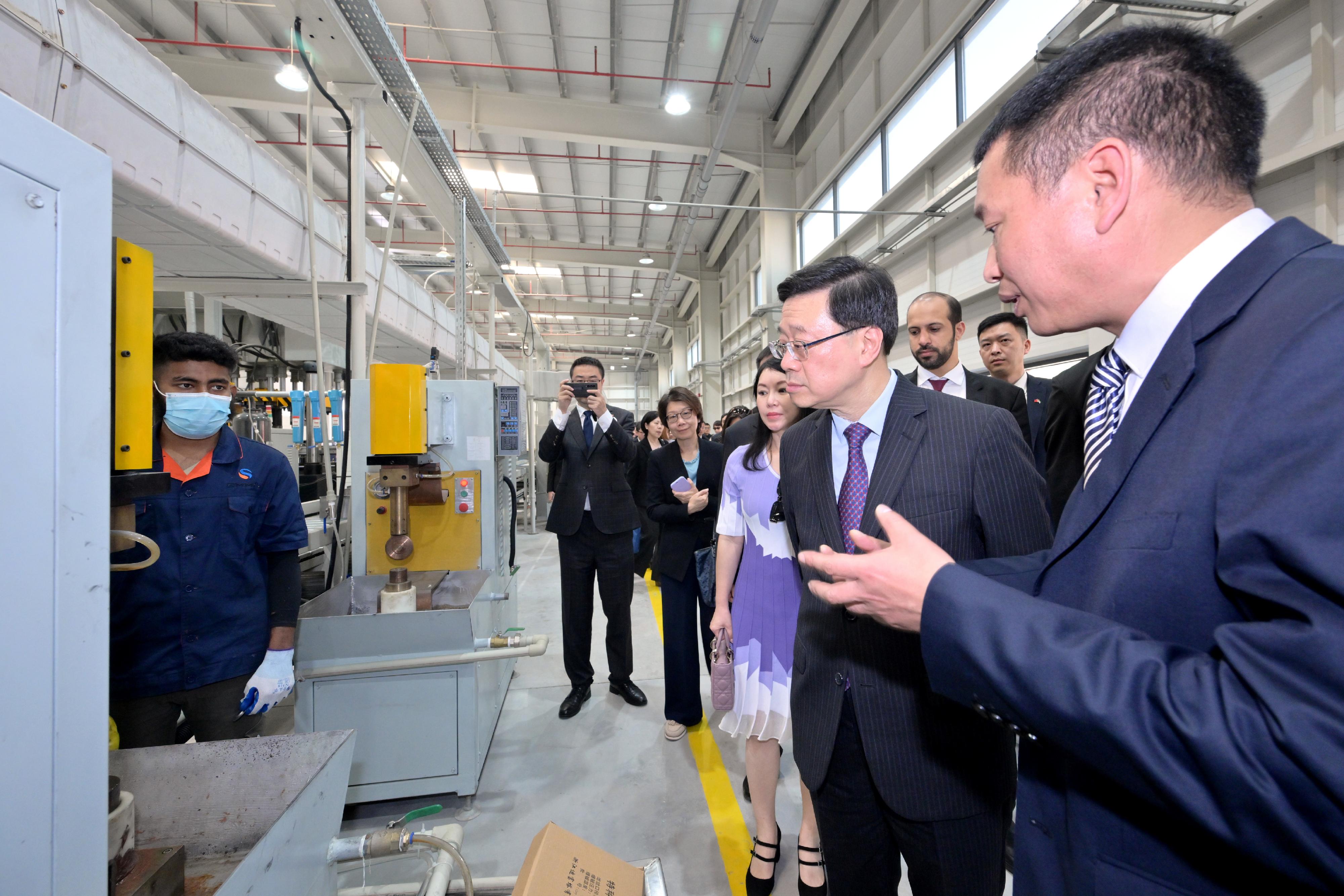The Chief Executive, Mr John Lee, toured the China-UAE Industrial Capacity Cooperation Demonstration Zone at the Khalifa Industrial Zone in Abu Dhabi, the United Arab Emirates, today (February 8, Abu Dhabi time). Photo shows Mr Lee (second right) touring the zone.