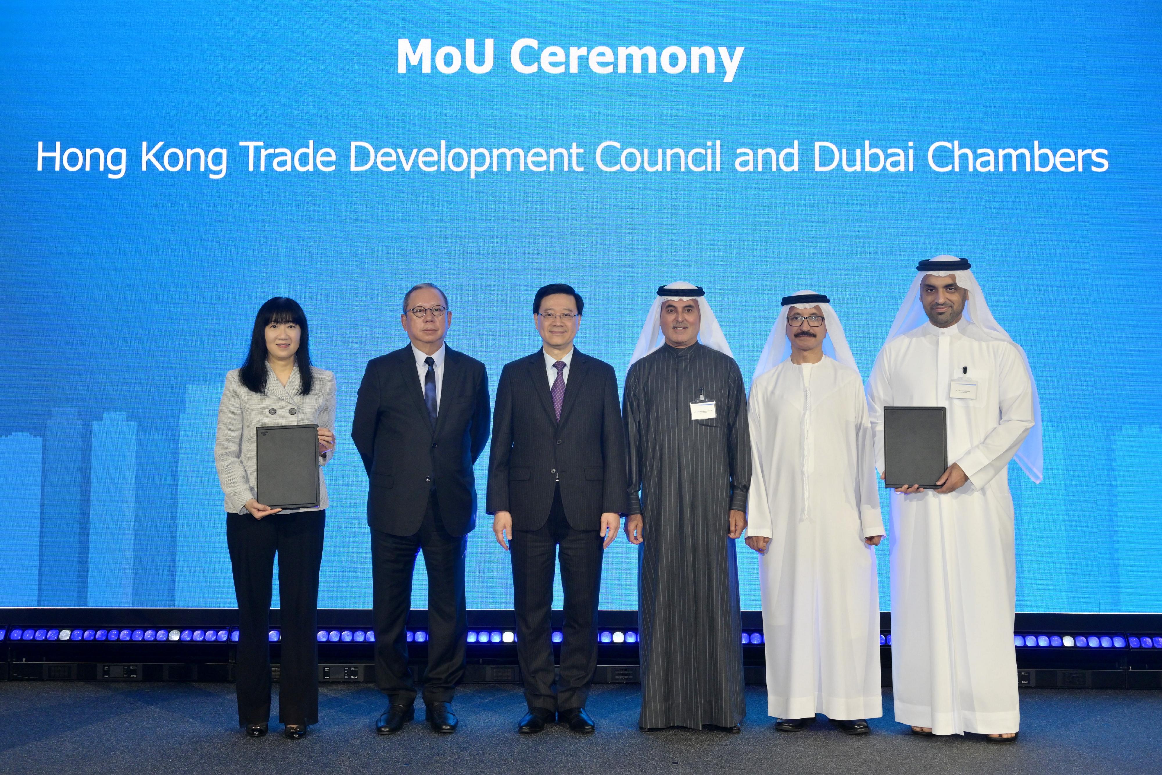 The Chief Executive, Mr John Lee, attended the UAE-Hong Kong Business Forum and Chinese New Year Gala Dinner in Dubai, the United Arab Emirates (UAE), today (February 8, Dubai time). Photo shows Mr Lee (third left); the Chairman of the Hong Kong Trade Development Council, Dr Peter Lam (second left); and the Chairman of Dubai Chambers, Mr Abdul-Aziz Abdulla Al Ghurair (third right) witnessing the exchange of Memorandum of Understanding between the Hong Kong Trade Development Council and the Dubai Chambers.
