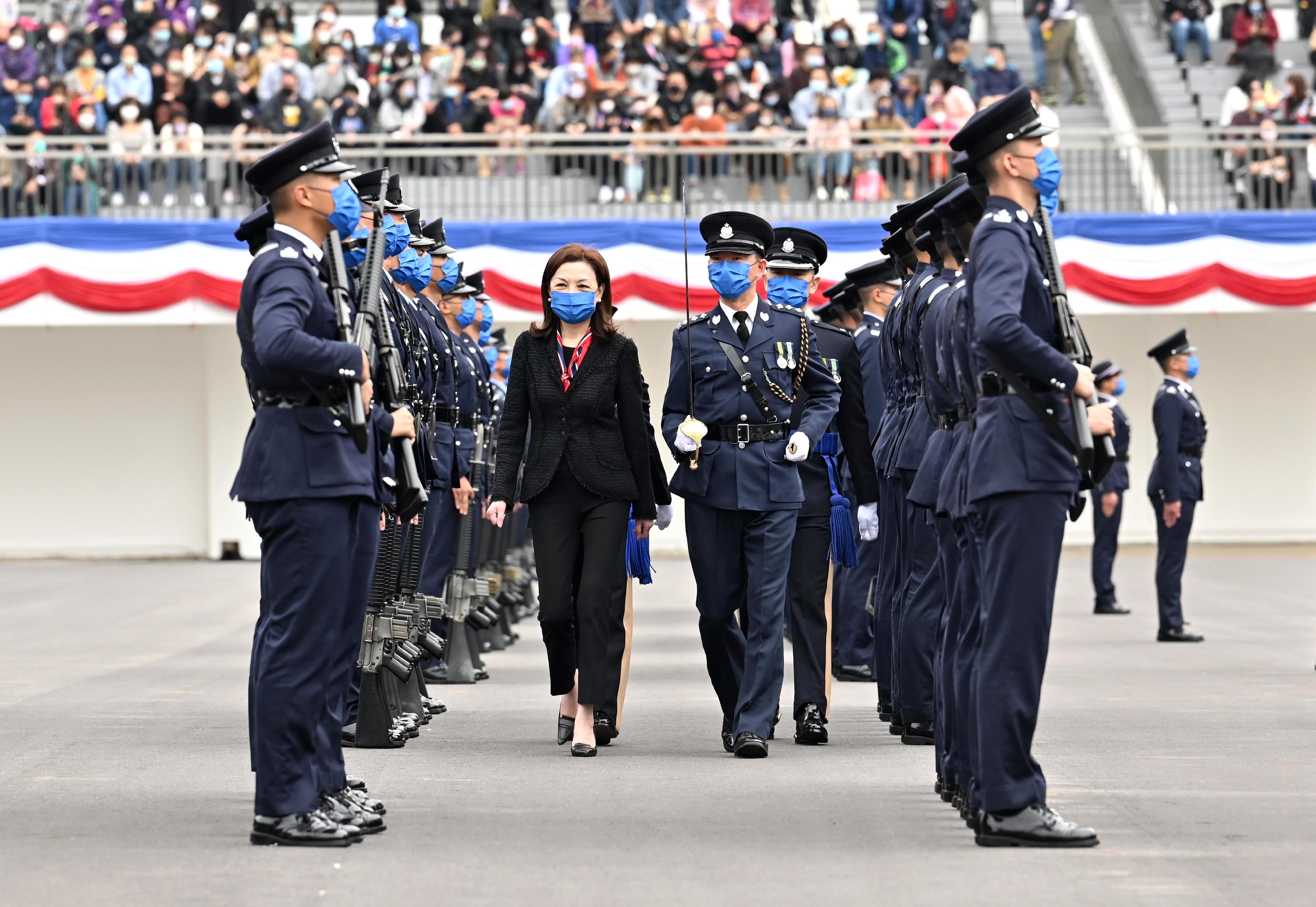 The Chairman of the Independent Police Complaints Council, Ms Priscilla Wong Pui-sze, inspects a passing-out parade as a reviewing officer at the Hong Kong Police College today (February 11).
