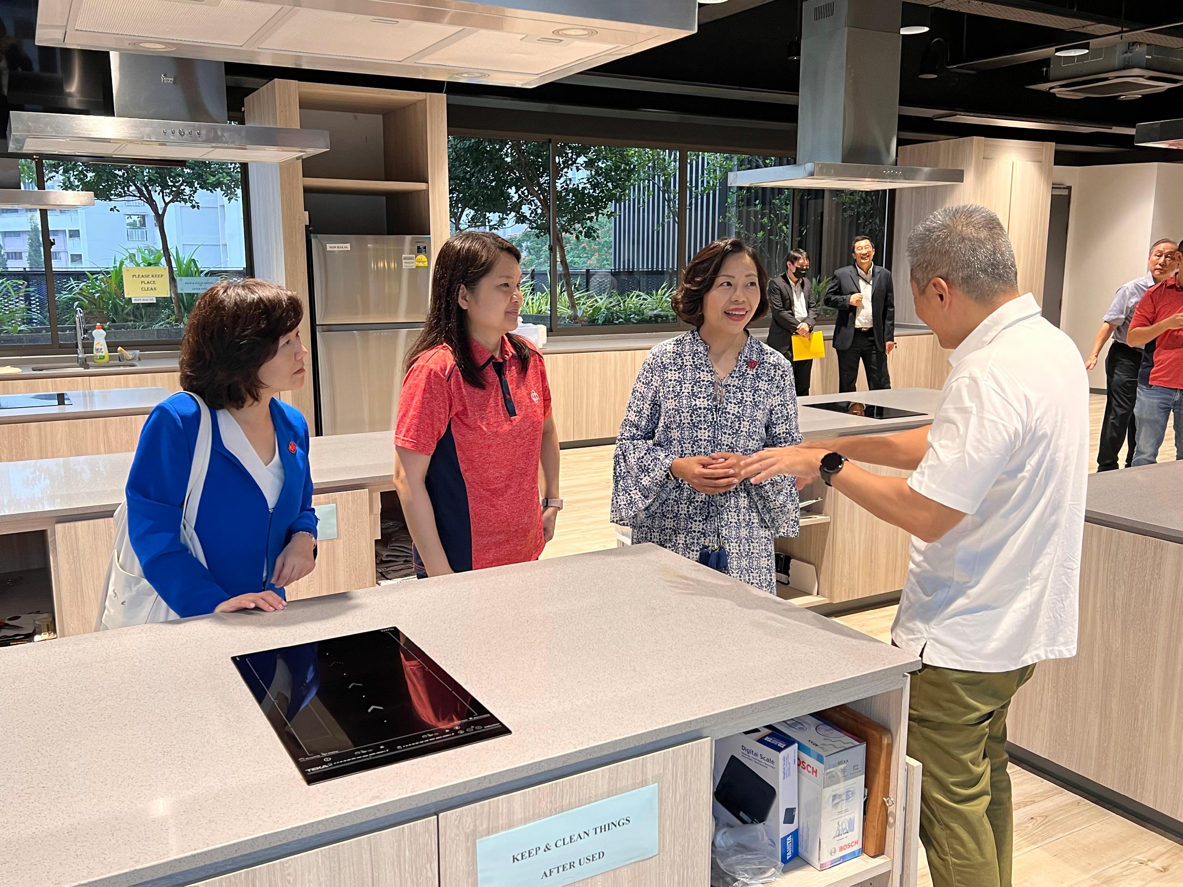 The Secretary for Home and Youth Affairs, Miss Alice Mak, continued her visit in Singapore today (February 17). Photo shows Miss Mak (second right) and the Director of Home Affairs, Mrs Alice Cheung (first left), visiting the Jurong Spring Community Club. 