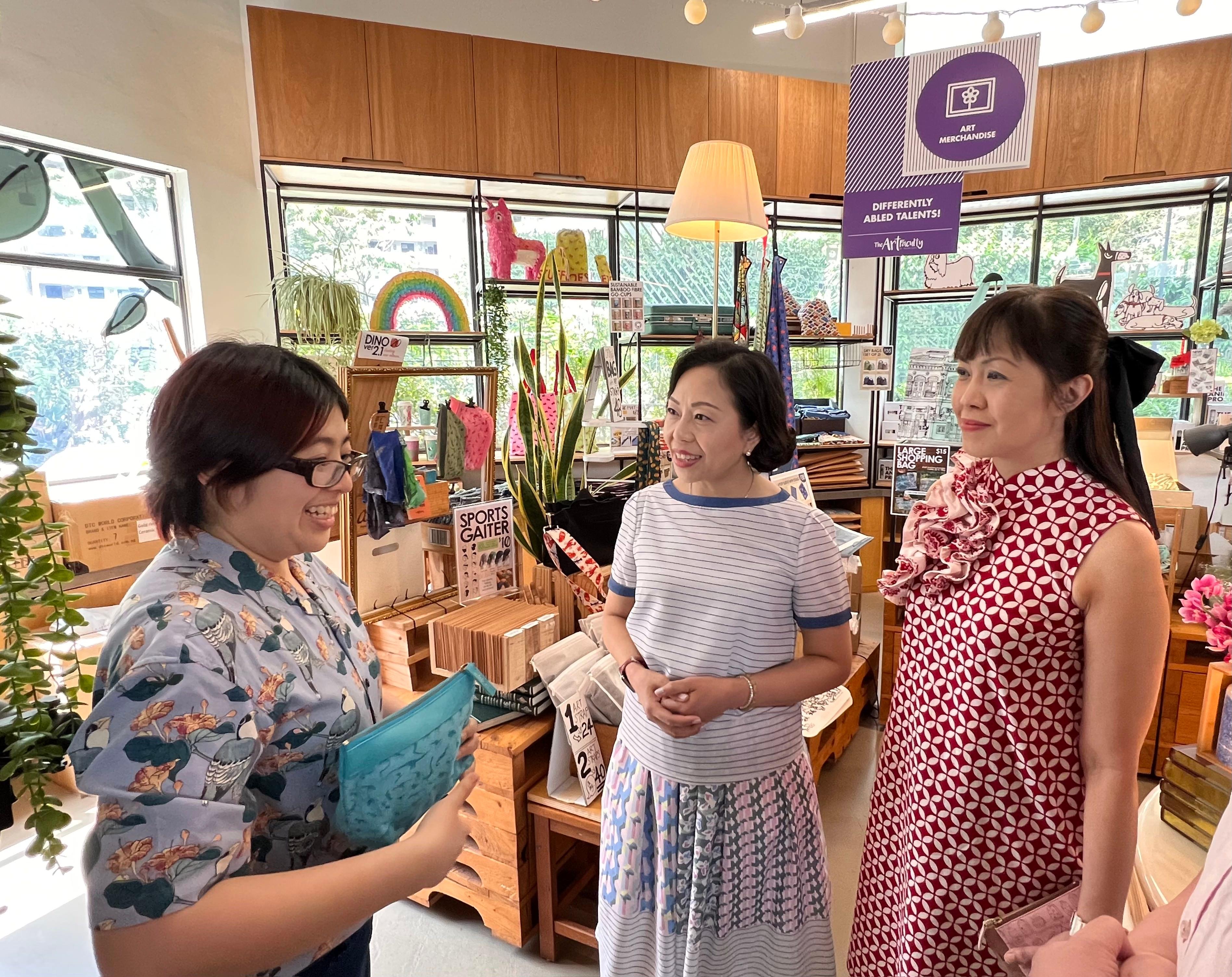 The Secretary for Home and Youth Affairs, Miss Alice Mak, today (February 18) visited the Enabling Village in Singapore. Photo shows Miss Mak (centre) looking at the handicrafts created by the people with special needs at the Village.