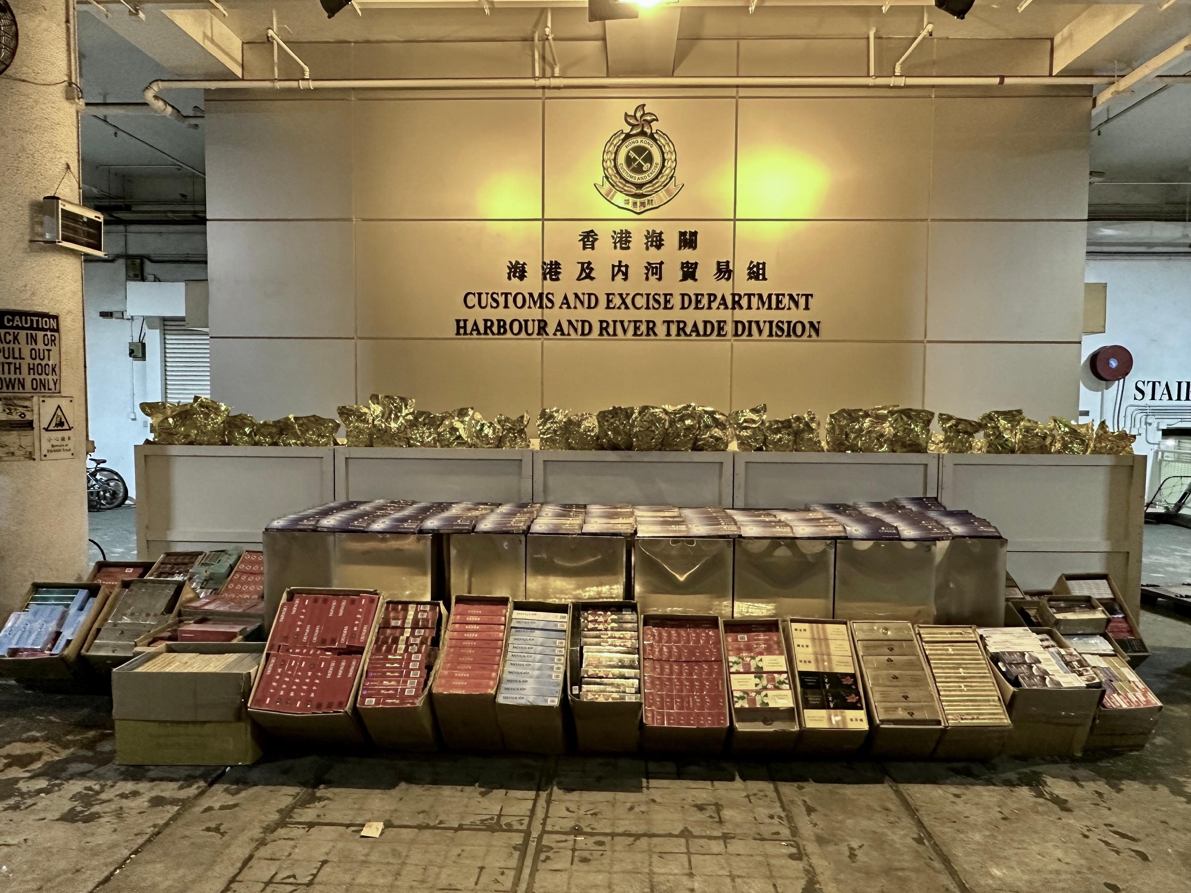 Hong Kong Customs on February 8 and 13 seized a batch of suspected smuggled tobacco products and liquor at the Tuen Mun River Trade Terminal Customs Cargo Examination Compound. It included about 1.5 million suspected illicit cigarettes, about 3 600 kilograms of suspected duty-not-paid manufactured tobacco and about 20 litres of suspected duty-not-paid liquor. The total estimated market value was about $14 million, with a duty potential of about $11 million. Photo shows the suspected smuggled tobacco products seized by Customs officers on February 8.