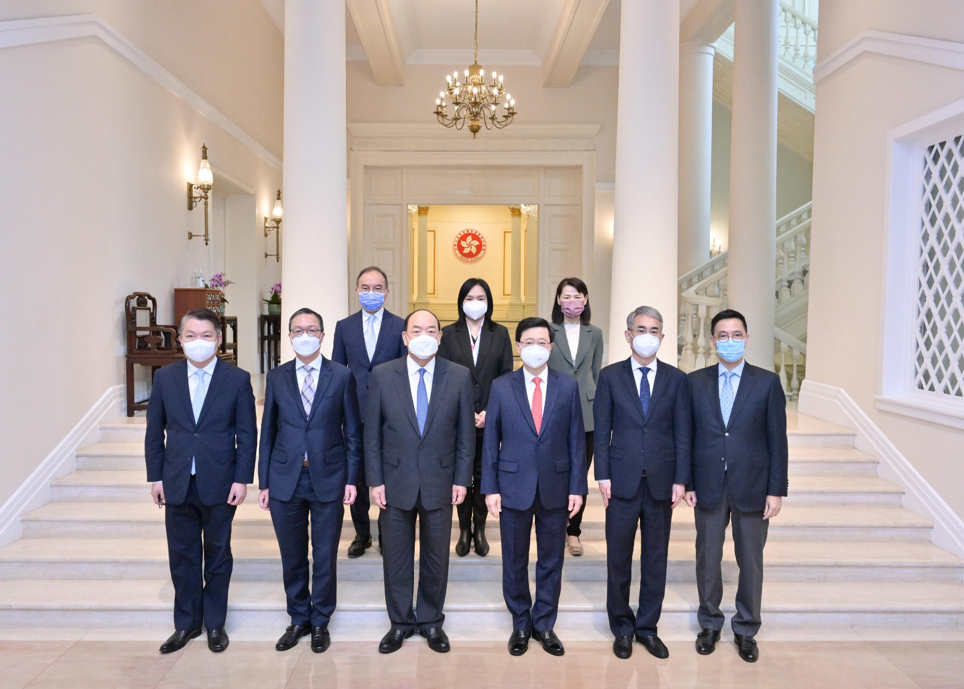 The Chief Executive, Mr John Lee (front row, third right), met with the Chief Executive of the Macao Special Administrative Region, Mr Ho Iat-seng (front row, third left), at Government House today (February 25). The Secretary for Justice, Mr Paul Lam, SC (front row, second left); the Secretary for Culture, Sports and Tourism, Mr Kevin Yeung (front row, first right); the Secretary for Constitutional and Mainland Affairs, Mr Erick Tsang Kwok-wai (back row, left), and the Director of the Chief Executive's Office, Ms Carol Yip (back row, right), also attended the meeting.