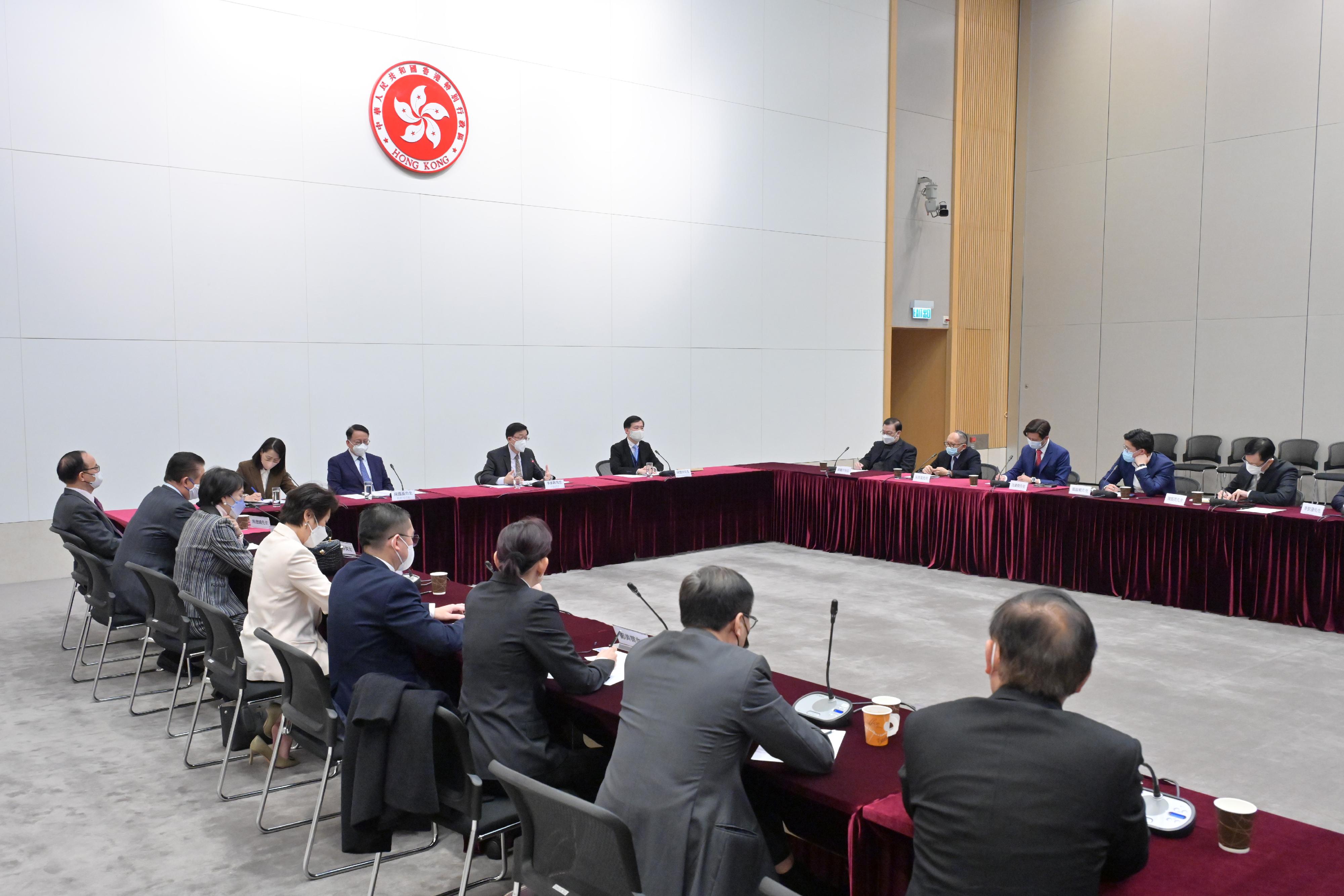 The Chief Executive, Mr John Lee (seventh right), holds an engagement session with about 30 Hong Kong deputies to the National People's Congress today (February 27).