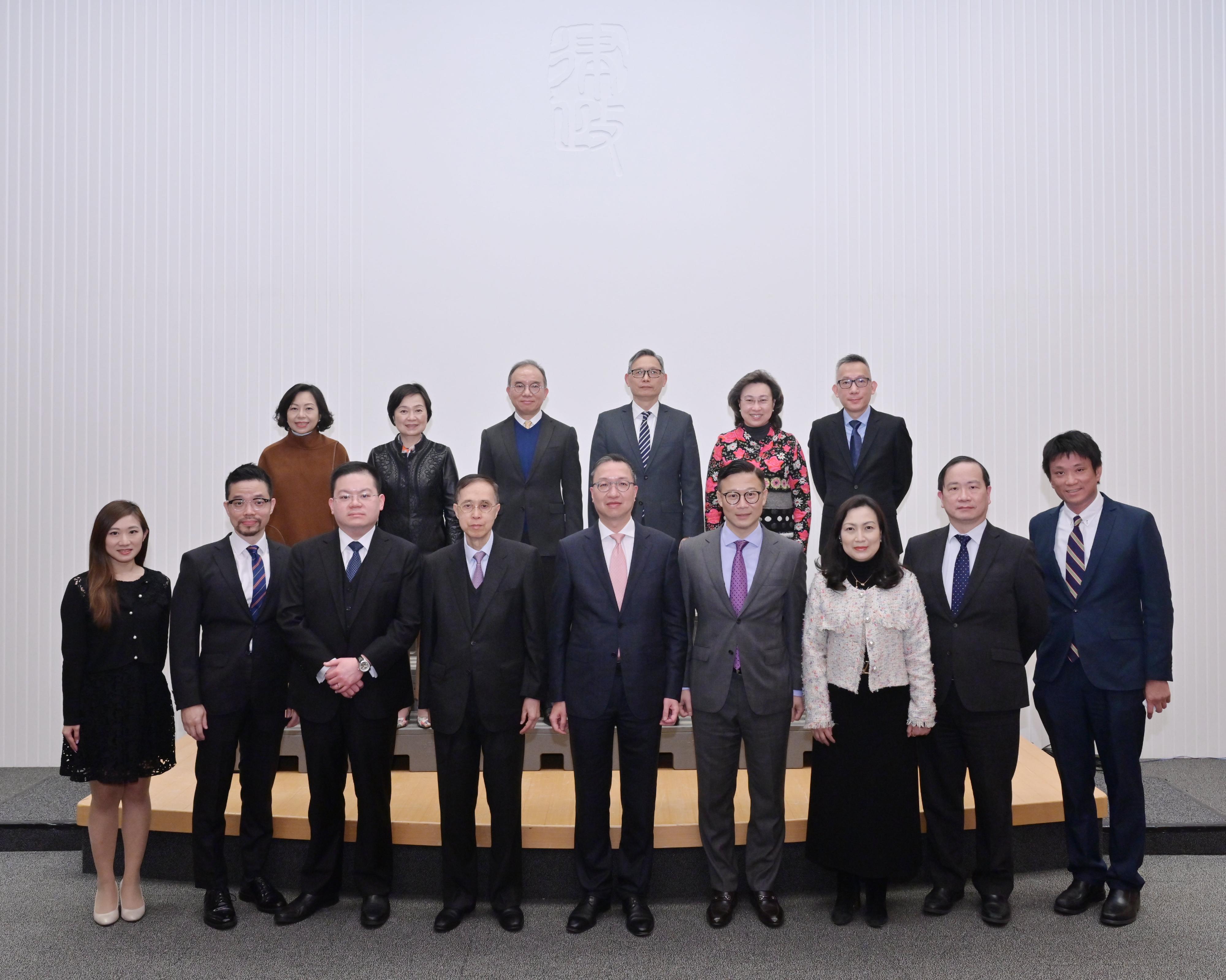 The Department of Justice's Steering Committee on Rule of Law Education held its first meeting this afternoon (February 28). Photo shows the Chairperson of the Steering Committee and Secretary for Justice, Mr Paul Lam, SC (front row, centre), and the Vice-Chairperson of the Steering Committee and Deputy Secretary for Justice, Mr Cheung Kwok-kwan (front row, fourth right), with non-official committee members Mr Justice Patrick Chan (front row, fourth left), Dr Peter Chan (front row, first right), Mr Jonathan Chang, SC (front row, third left), Mr Matthew Cheung (front row, second left), Mr Wilson Chow (first row, second right), Ms Carmen Kan (front row, third right) and Ms Sharon Tam (front row, first left) before the meeting. Also present are official committee members the Secretary for Constitutional and Mainland Affairs, Mr Erick Tsang Kwok-wai (back row, third left); the Secretary for the Civil Service, Mrs Ingrid Yeung (back row, second right); the Secretary for Education, Dr Choi Yuk-lin (back row, second left); the Secretary for Home and Youth Affairs, Miss Alice Mak (back row, first left); the Acting Secretary for Security, Mr Michael Cheuk (back row, third right); and the Solicitor General of the Department of Justice, Mr Llewellyn Mui (back row, first right).