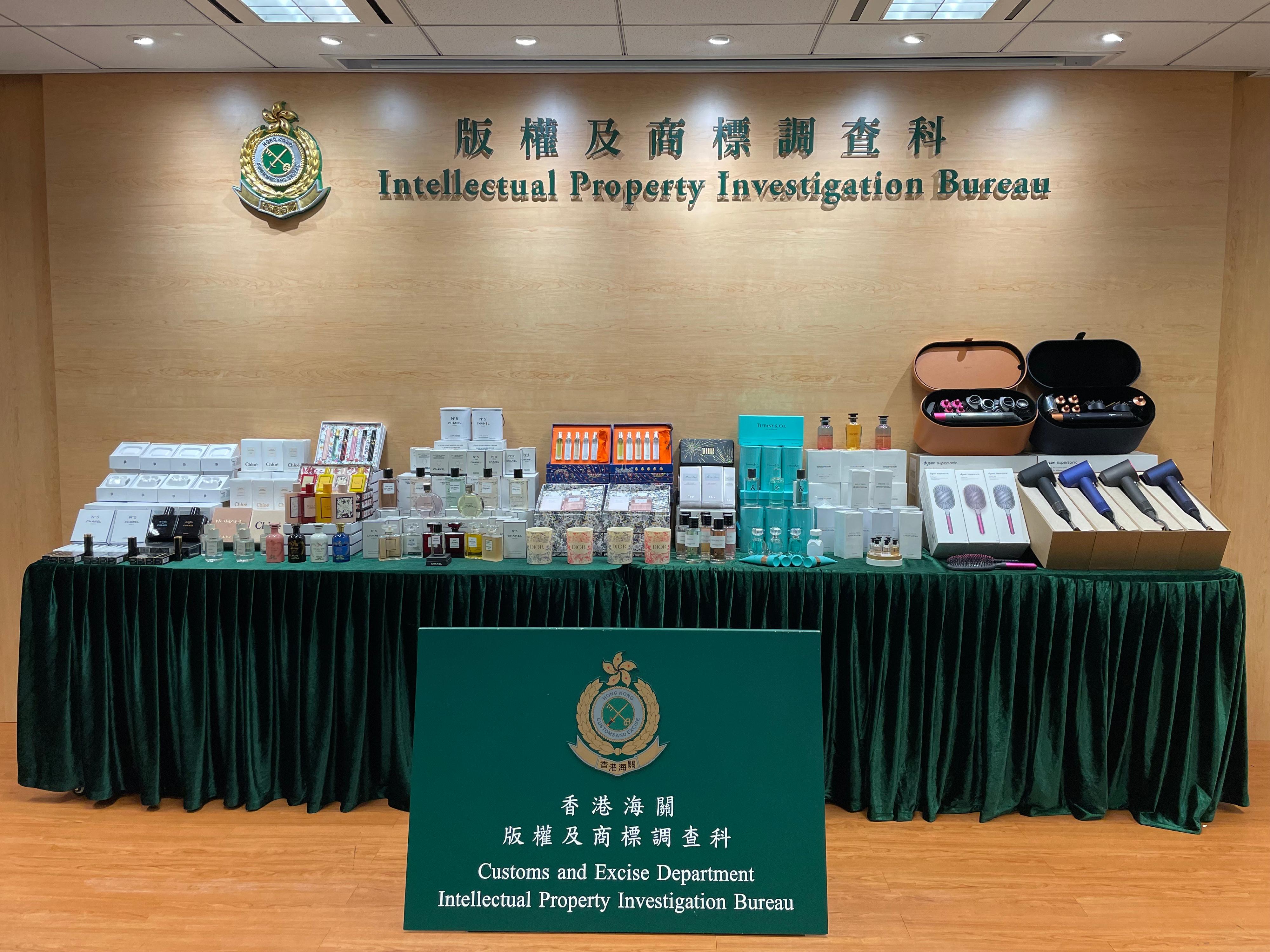 Hong Kong Customs yesterday (February 27) conducted an enforcement operation to combat the online sale of counterfeit cosmetics products, perfume and electric appliances with seizures of about 1 800 items of suspected counterfeit products with an estimated market value of about $330,000. Photo shows some of the suspected counterfeit products seized.