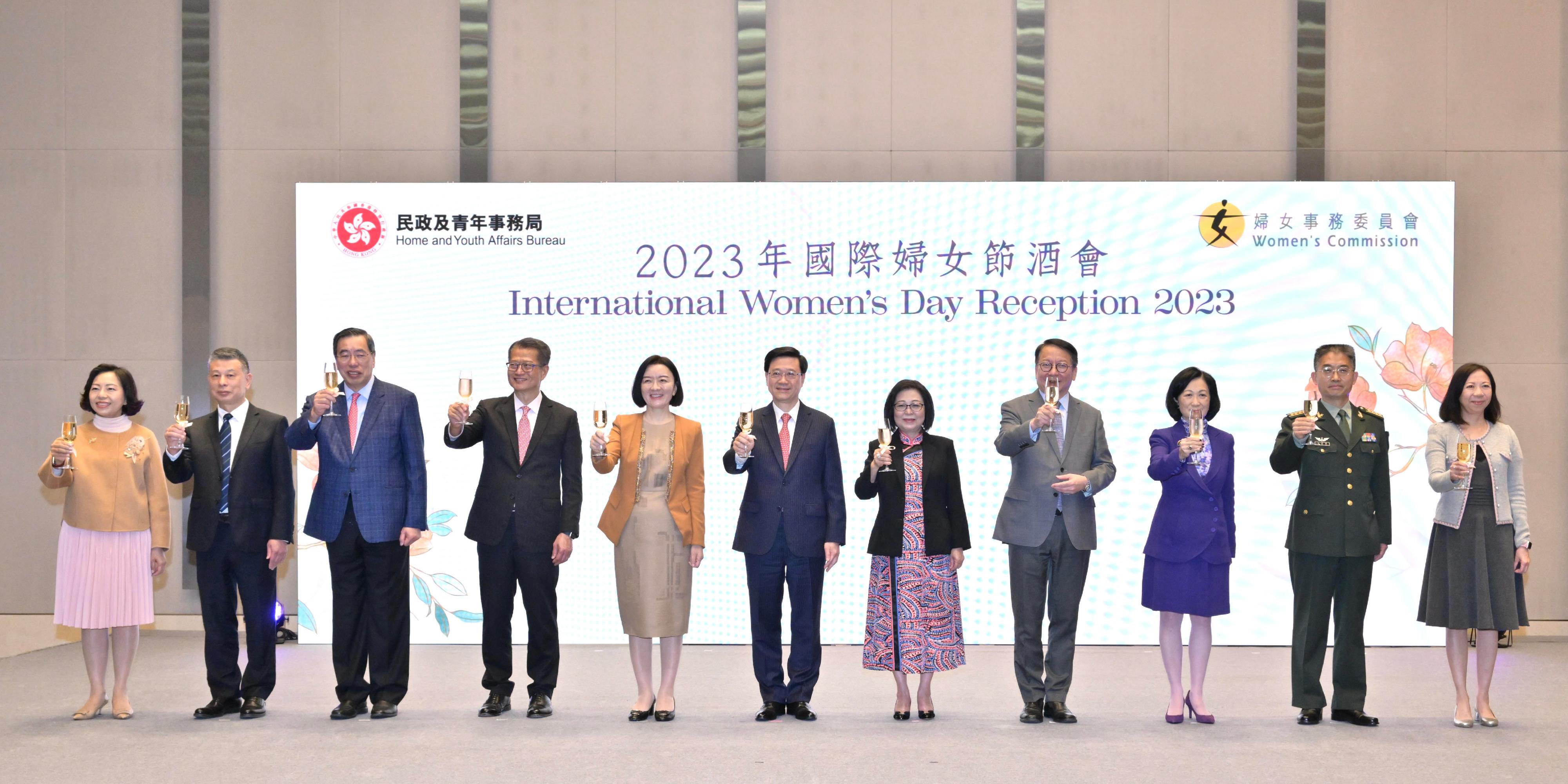 The Chief Executive, Mr John Lee, attended the International Women's Day Reception 2023 today (March 8). Photo shows (from left) the Secretary for Home and Youth Affairs, Miss Alice Mak; the Deputy Director General of the Office for Safeguarding National Security of the Central People's Government (CPG) in the Hong Kong Special Administrative Region (HKSAR) Mr Wang Wenxian; the President of the Legislative Council, Mr Andrew Leung; the Financial Secretary, Mr Paul Chan; Deputy Director of the Liaison Office of the CPG in the HKSAR Ms Lu Xinning; Mr Lee and his wife Mrs Janet Lee; the Chief Secretary for Administration, Mr Chan Kwok-ki; the Convenor of the Non-official Members of the Executive Council, Mrs Regina Ip; Deputy Director of the Political Department of the Chinese People's Liberation Army Hong Kong Garrison Senior Colonel Wang Zhixue; and the Permanent Secretary for Home and Youth Affairs, Ms Shirley Lam, officiating at the toasting ceremony.
