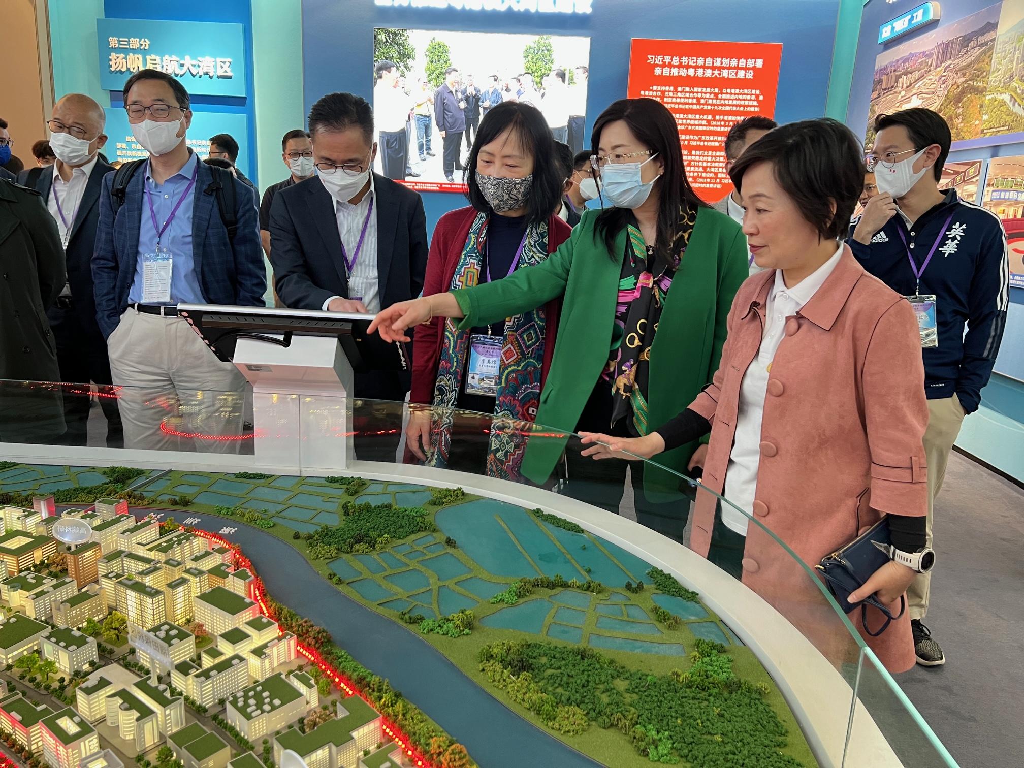 The Secretary for Education, Dr Choi Yuk-lin, today (March 9) led a delegation to visit Shenzhen and Guangzhou to inspect the relevant arrangements for Mainland study tours of the senior secondary subject of Citizenship and Social Development. Photo shows Dr Choi (first right) and the Permanent Secretary for Education, Ms Michelle Li (third right), with other members of the delegation touring an exhibition celebrating the 40th anniversary of the Shenzhen Special Economic Zone at the Shenzhen Qianhai International Convention Center.