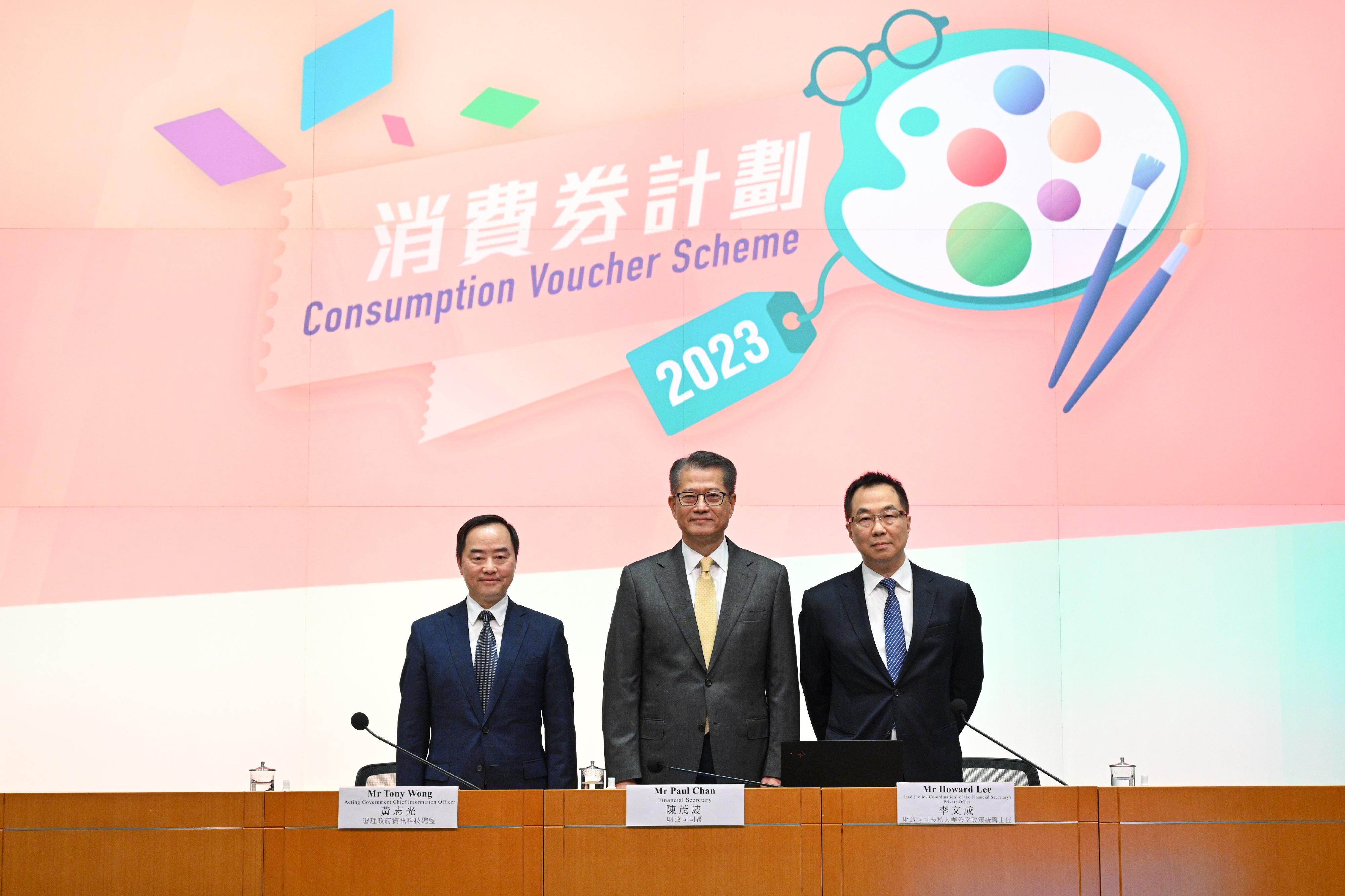 The Financial Secretary, Mr Paul Chan (centre), holds a press conference to announce details of the 2023 Consumption Voucher Scheme with the Acting Government Chief Information Officer, Mr Tony Wong (left), and the Head (Policy Co-ordination) of the Financial Secretary's Private Office, Mr Howard Lee (right), at the Central Government Offices, Tamar, this afternoon (March 10).