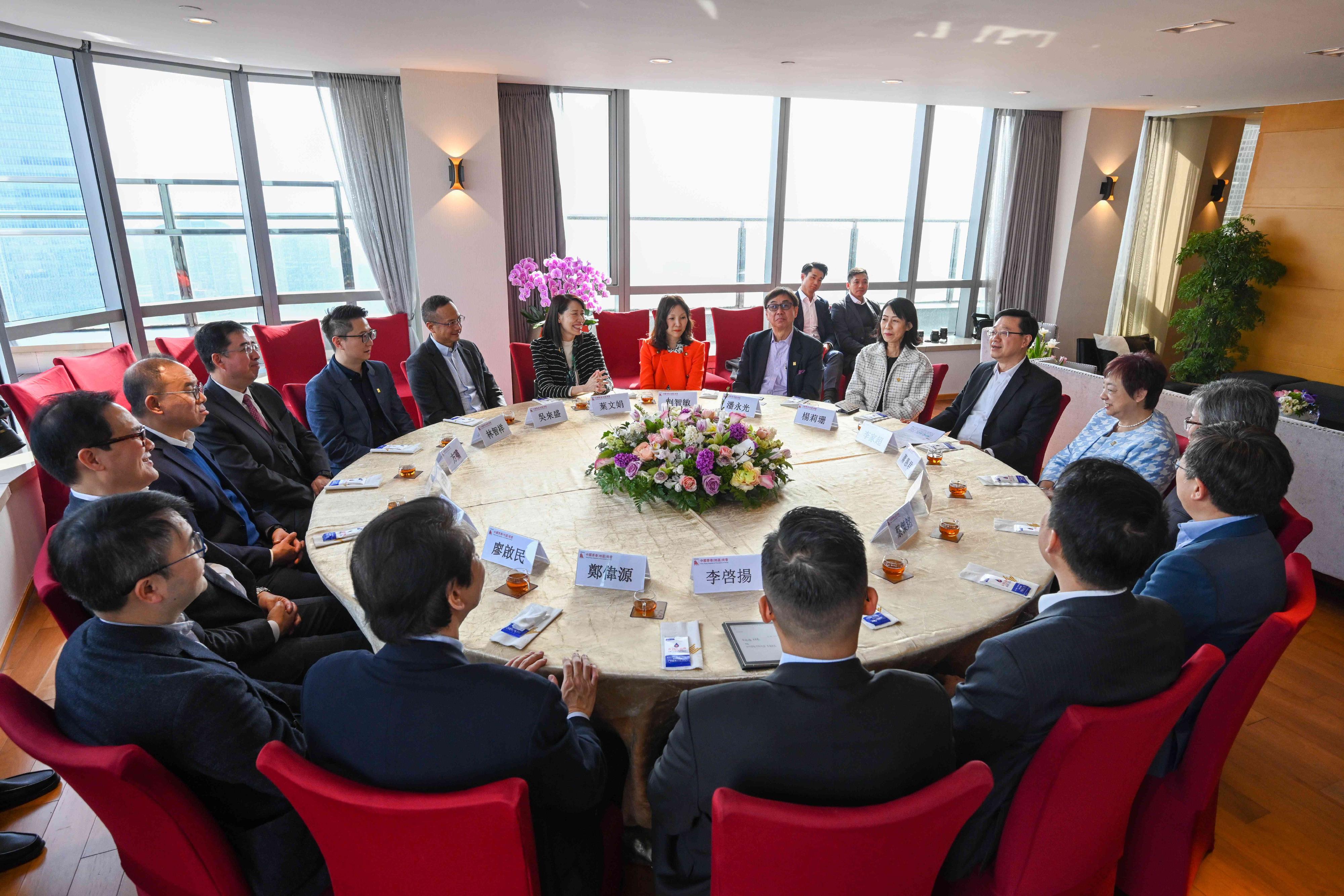 The Chief Executive, Mr John Lee (second right), attends a tea gathering in Beijing with members of the Hong Kong Chamber of Commerce in China this afternoon (March 13).