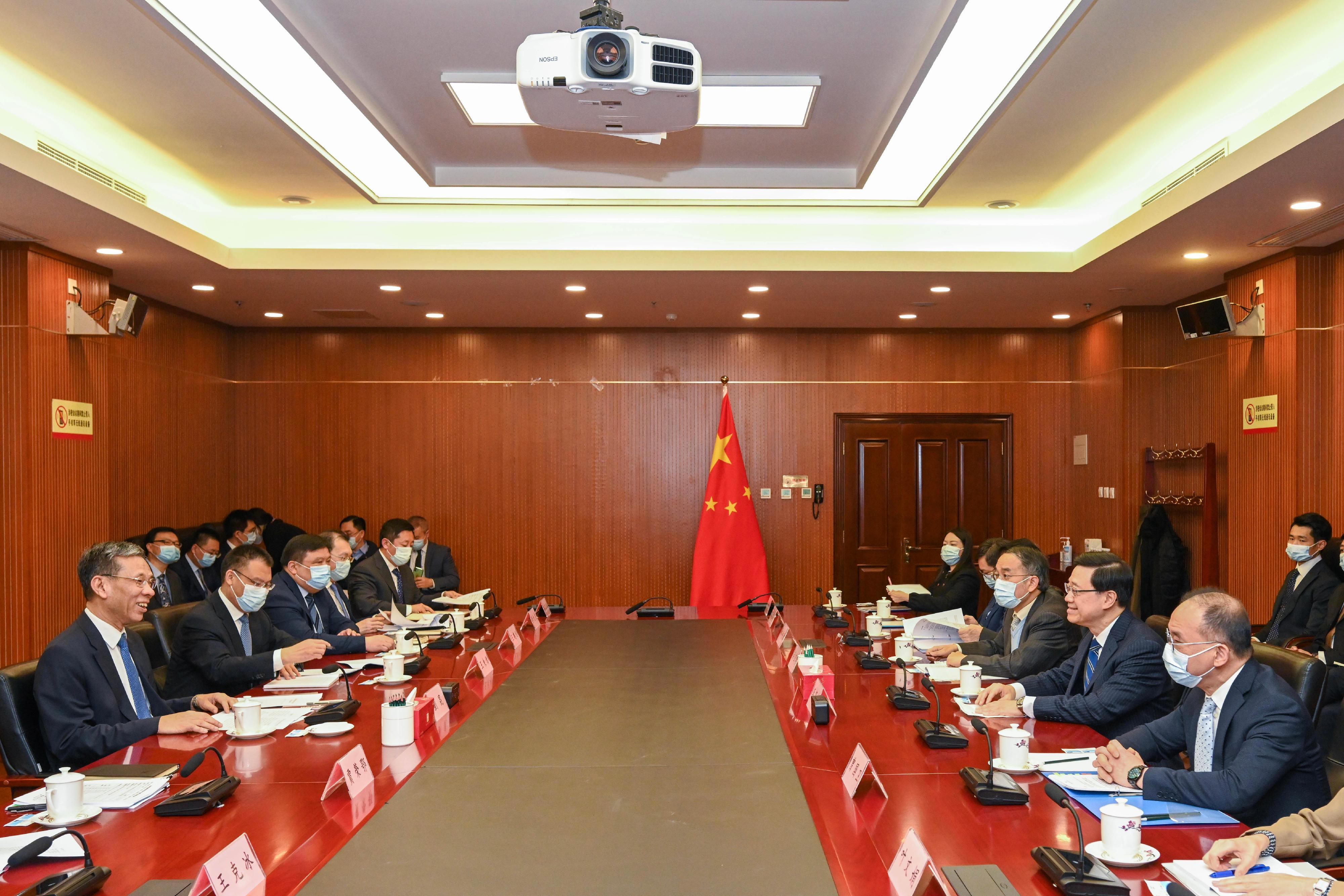 The Chief Executive, Mr John Lee (second right), meets with the Minister of Finance, Mr Liu Kun (first left), in Beijing this morning (March 14). Also joining the meeting are the Secretary for Constitutional and Mainland Affairs, Mr Erick Tsang Kwok-wai (first right), and the Secretary for Financial Services and the Treasury, Mr Christopher Hui (third right). 