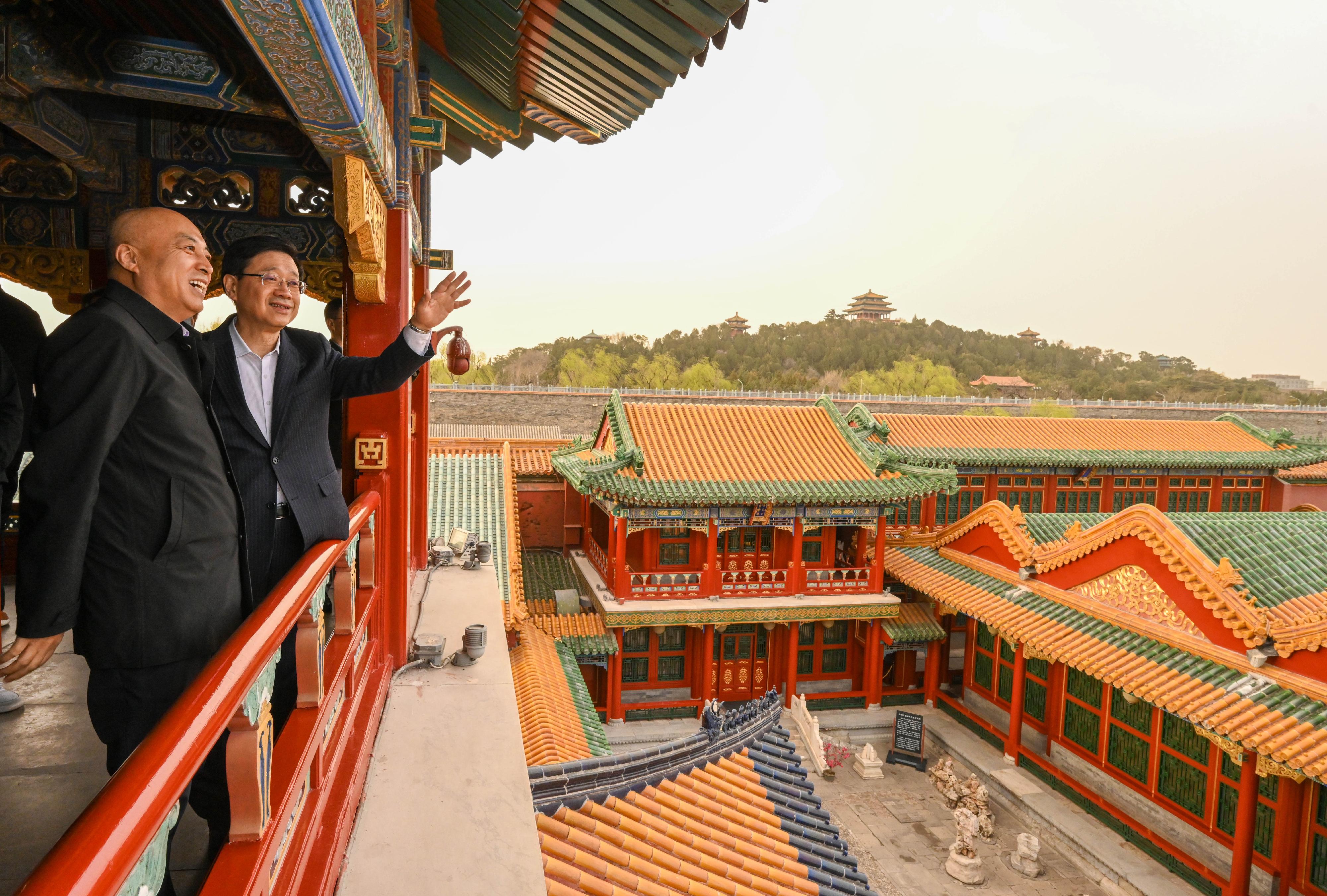 The Chief Executive, Mr John Lee, visited the Palace Museum  in Beijing this afternoon (March 14). Photo shows Mr Lee (right) touring the Belvedere of Prolonged Spring. Looking on is the Director of the Palace Museum, Dr Wang Xudong (left).