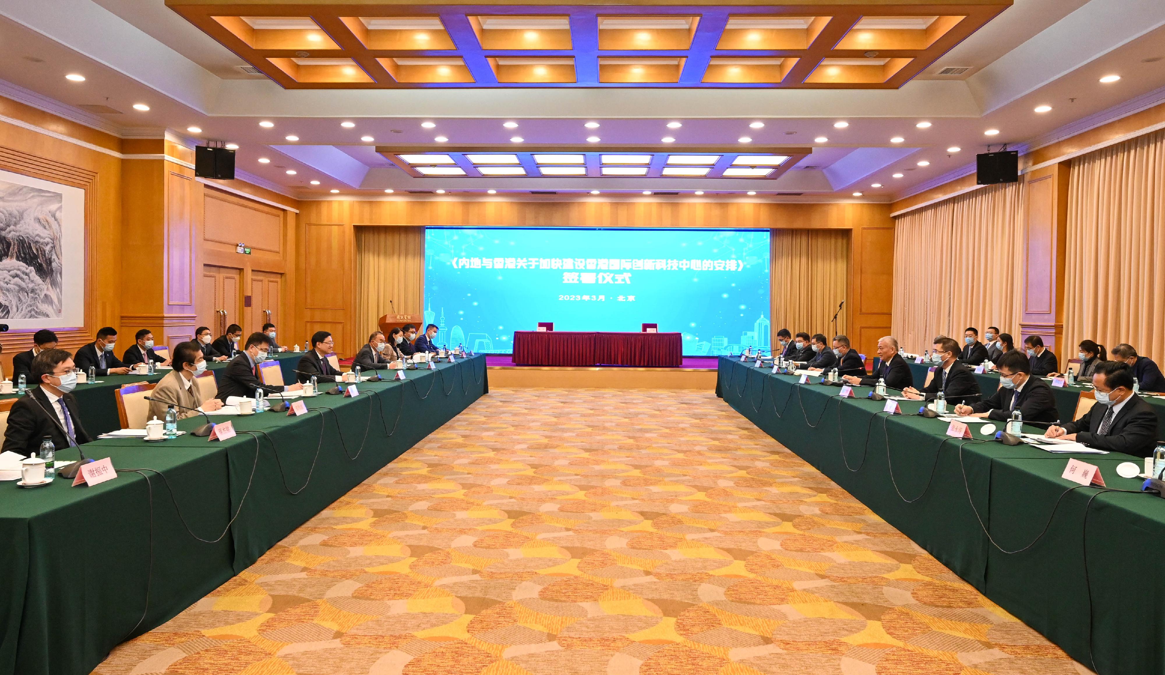 The Chief Executive, Mr John Lee (fourth left), meets with the Minister of Science and Technology, Mr Wang Zhigang (fourth right), in Beijing this morning (March 15). Also joining the meeting are the Secretary for Constitutional and Mainland Affairs, Mr Erick Tsang Kwok-wai (fifth left), and the Secretary for Innovation, Technology and Industry, Professor Sun Dong (third left).