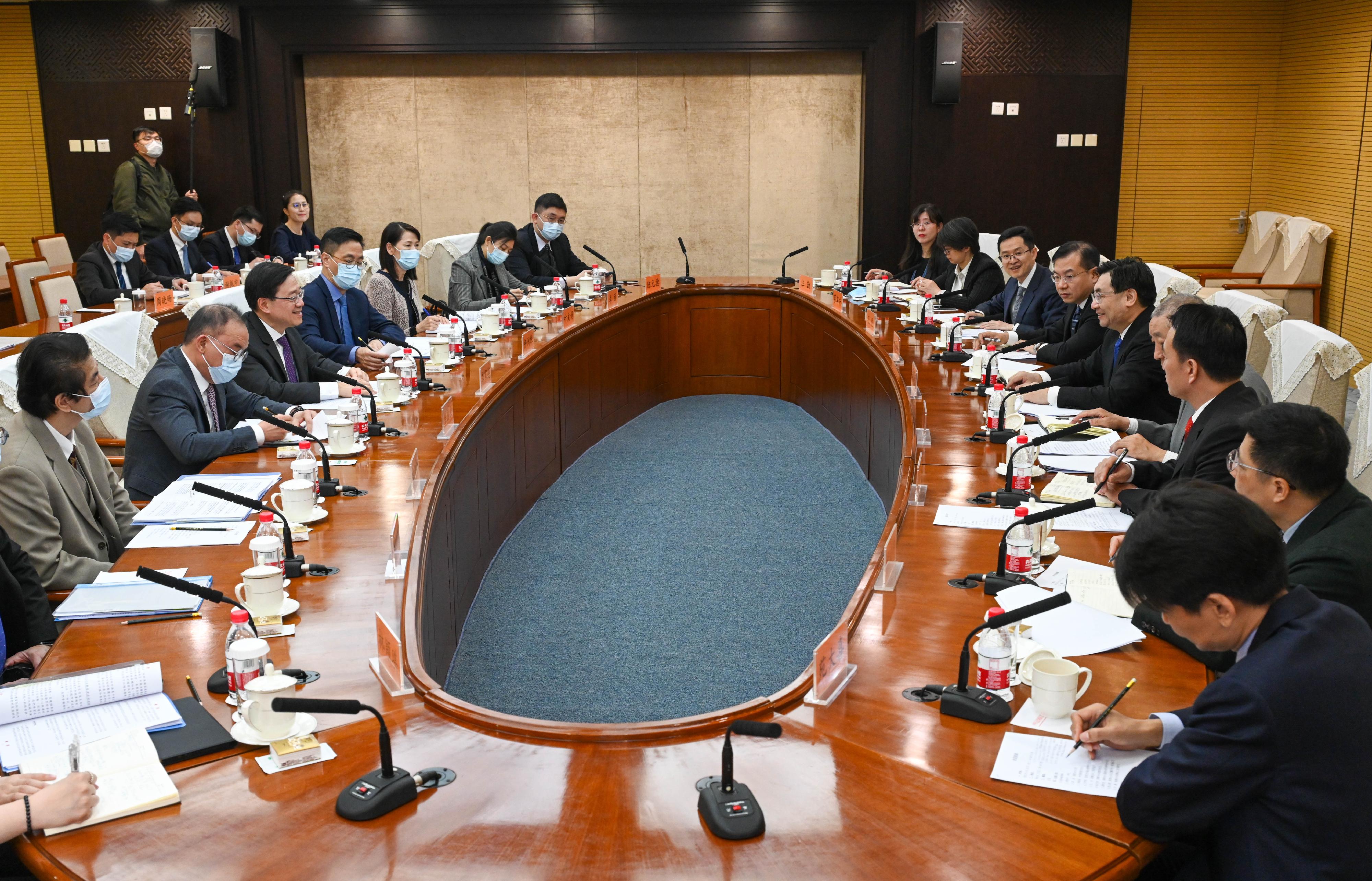 The Chief Executive, Mr John Lee (third left), meets with the Minister of Culture and Tourism, Mr Hu Heping (fifth right), in Beijing this morning (March 15). Also attending the meeting are the Secretary for Culture, Sports and Tourism, Mr Kevin Yeung (fourth left), and the Secretary for Constitutional and Mainland Affairs, Mr Erick Tsang Kwok-wai (second left).