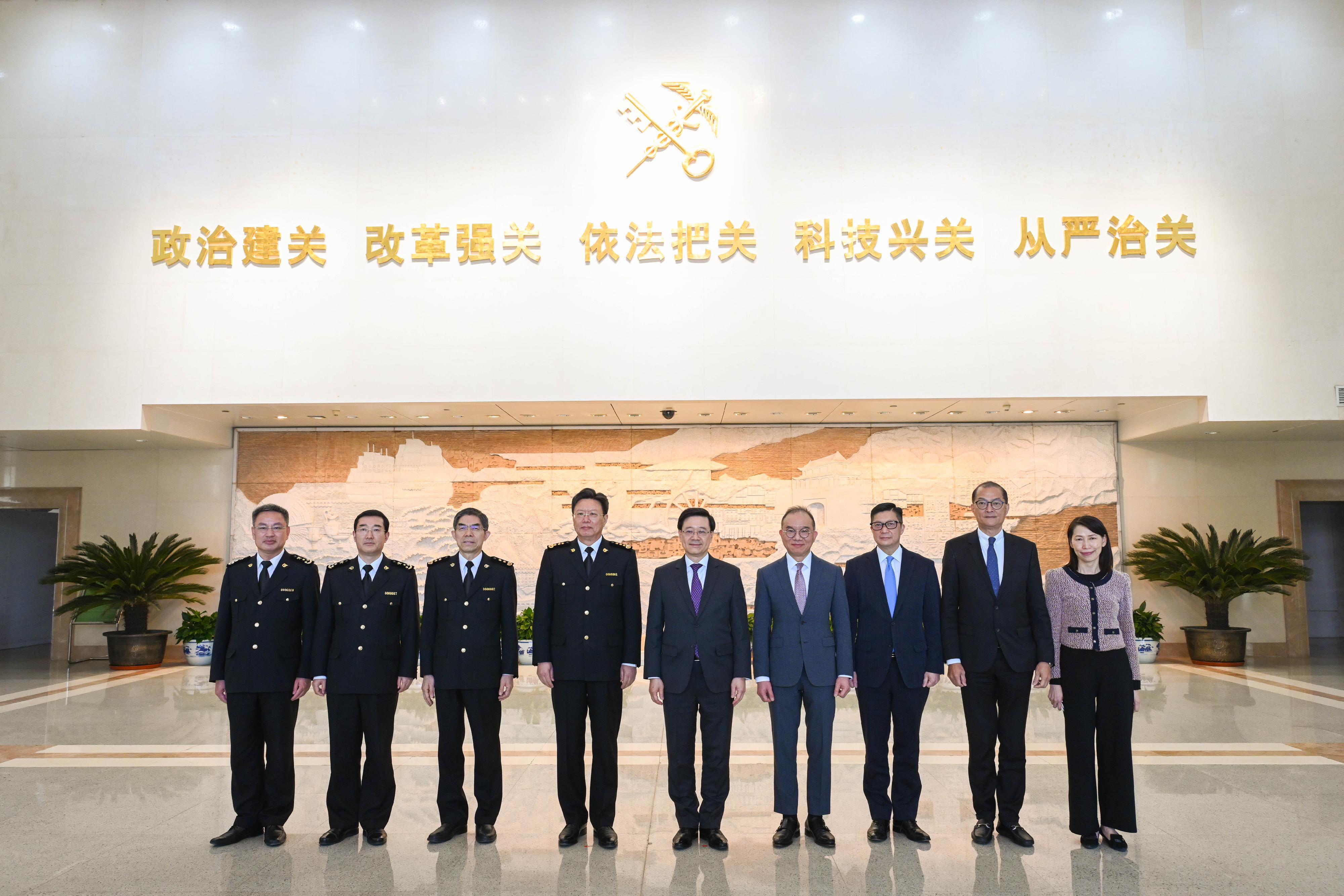 The Chief Executive, Mr John Lee (centre), meets with the Minister of General Administration of Customs, Mr Yu Jianhua (fourth left), in Beijing this afternoon (March 15). Also attending the meeting are the Secretary for Constitutional and Mainland Affairs, Mr Erick Tsang Kwok-wai (fourth right); the Secretary for Security, Mr Tang Ping-keung (third right); and the Secretary for Health, Professor Lo Chung-mau (second right).