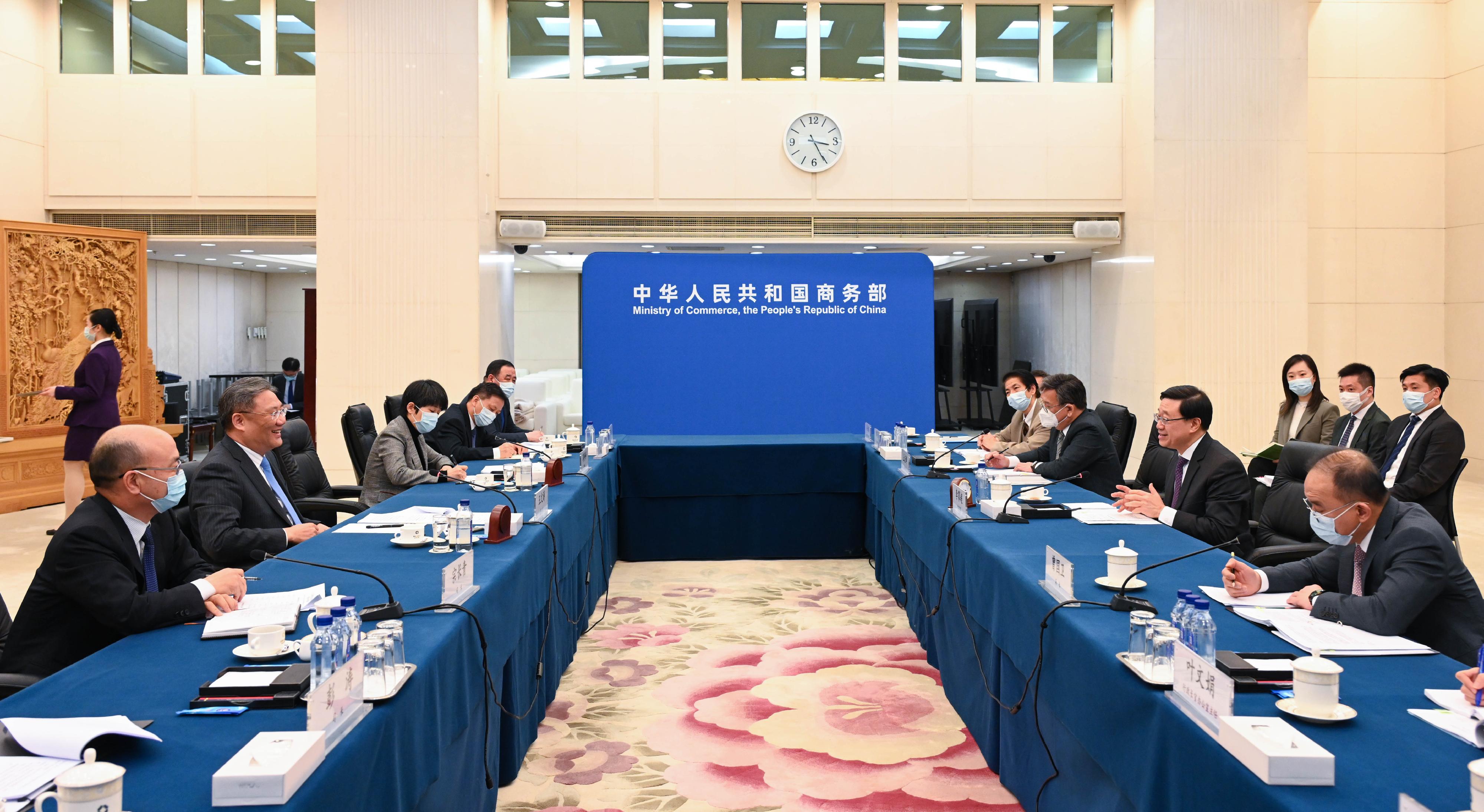 The Chief Executive, Mr John Lee (second right), meets with the Minister of Commerce, Mr Wang Wentao (second left), in Beijing this afternoon (March 15). Also attending the meeting are the Secretary for Constitutional and Mainland Affairs, Mr Erick Tsang Kwok-wai (first right), and the Secretary for Commerce and Economic Development, Mr Algernon Yau (third right).