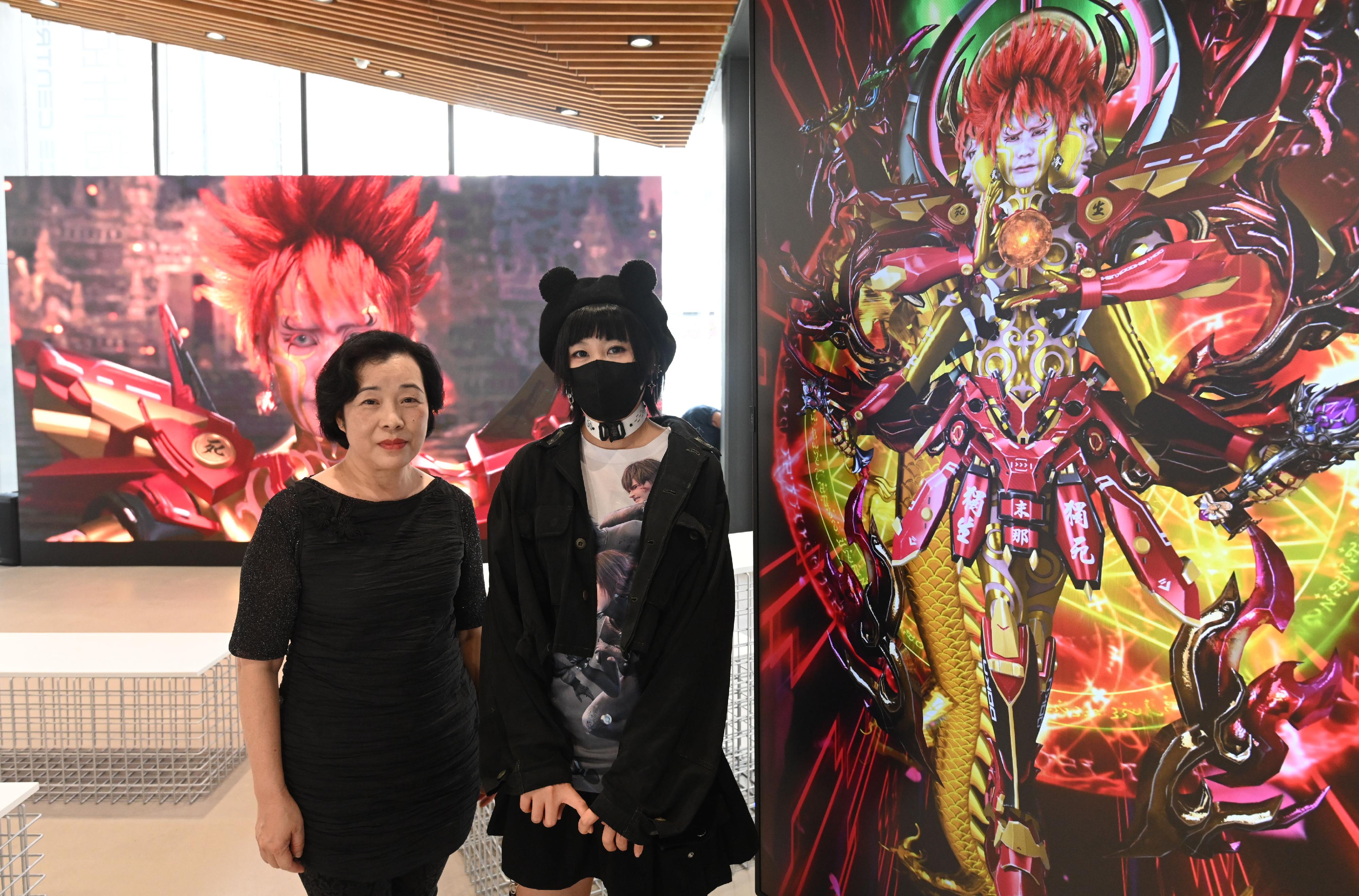 The Oil Street Art Space (Oi!) presents the "DOKU Hong Kong Experience Centre" exhibition by Mainland new media artist Lu Yang from tomorrow (March 18) to August 27. Photo shows the Head of the Art Promotion Office, Dr Lesley Lau (left), and Lu (right).