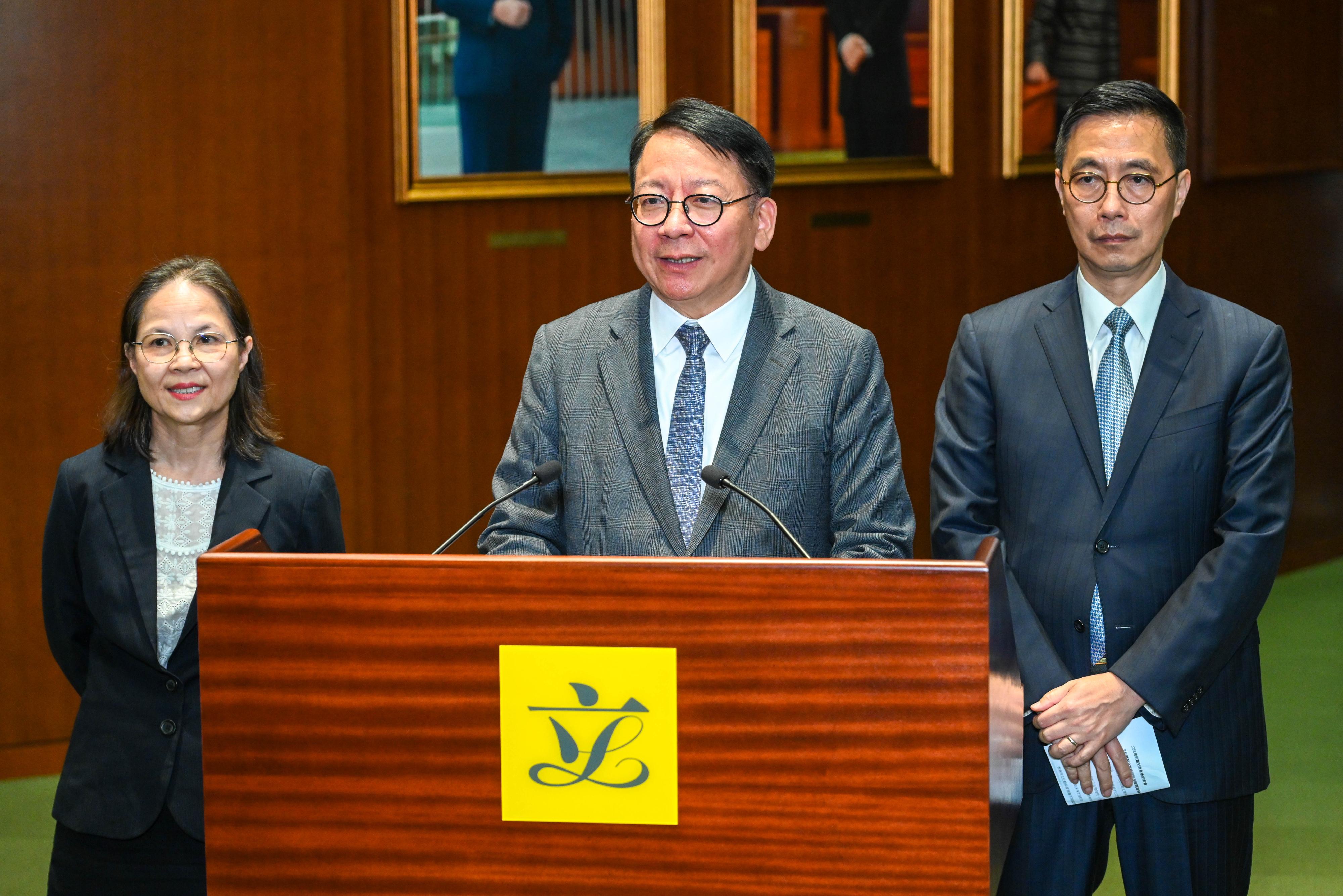 The Chief Secretary for Administration, Mr Chan Kwok-ki (centre); the Secretary for Culture, Sports and Tourism, Mr Kevin Yeung (right); and the Under Secretary for Environment and Ecology, Miss Diane Wong (left), meet the media after attending the Ante Chamber exchange session at the Legislative Council today (March 22).