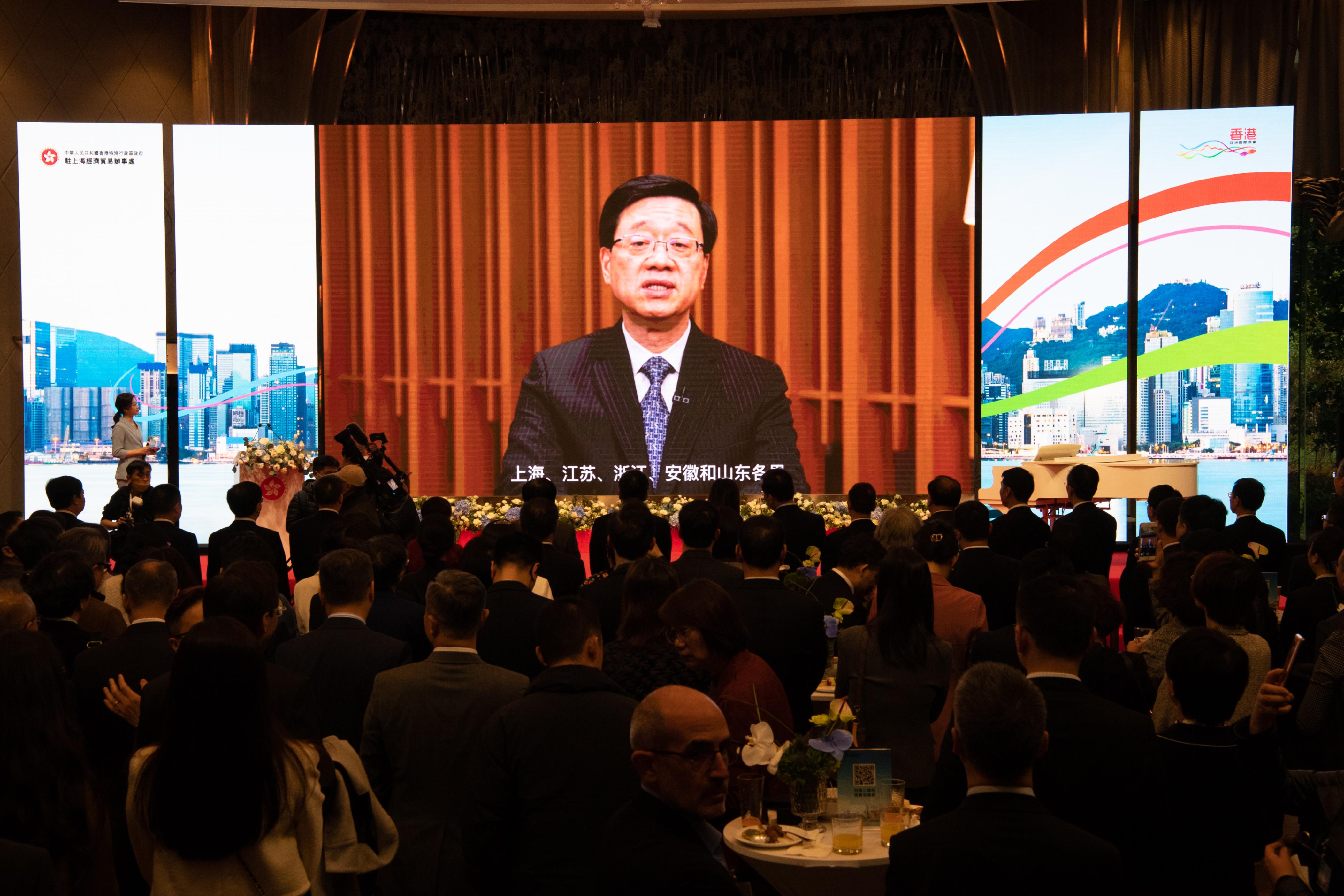 The Hong Kong Economic and Trade Office in Shanghai held a "Hello, Hong Kong!" East China Region Reception in Shanghai today (March 23). Photo shows the Chief Executive, Mr John Lee, delivering a pre-recorded speech at the reception.