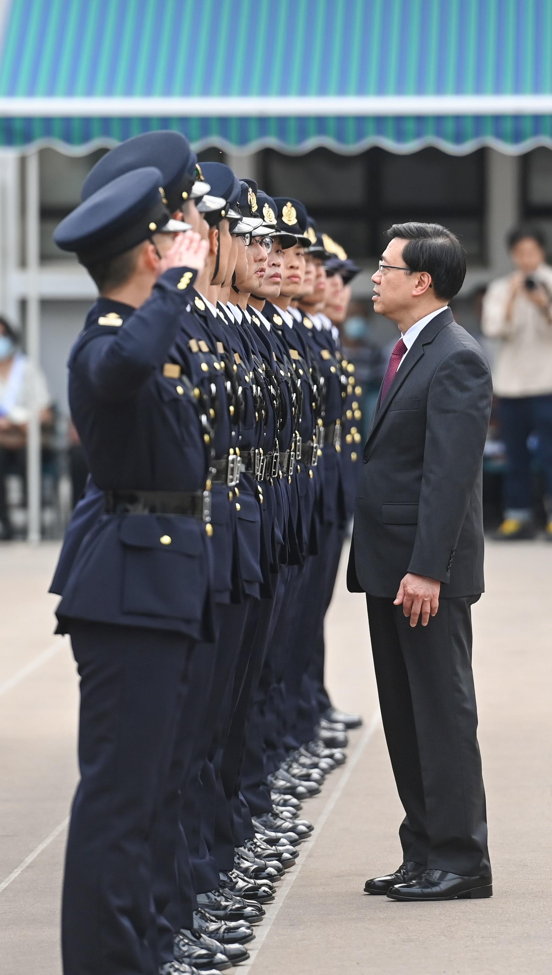 The Chief Executive, Mr John Lee, inspects passing-out officers at the Hong Kong Customs Passing-out Parade today (March 24).