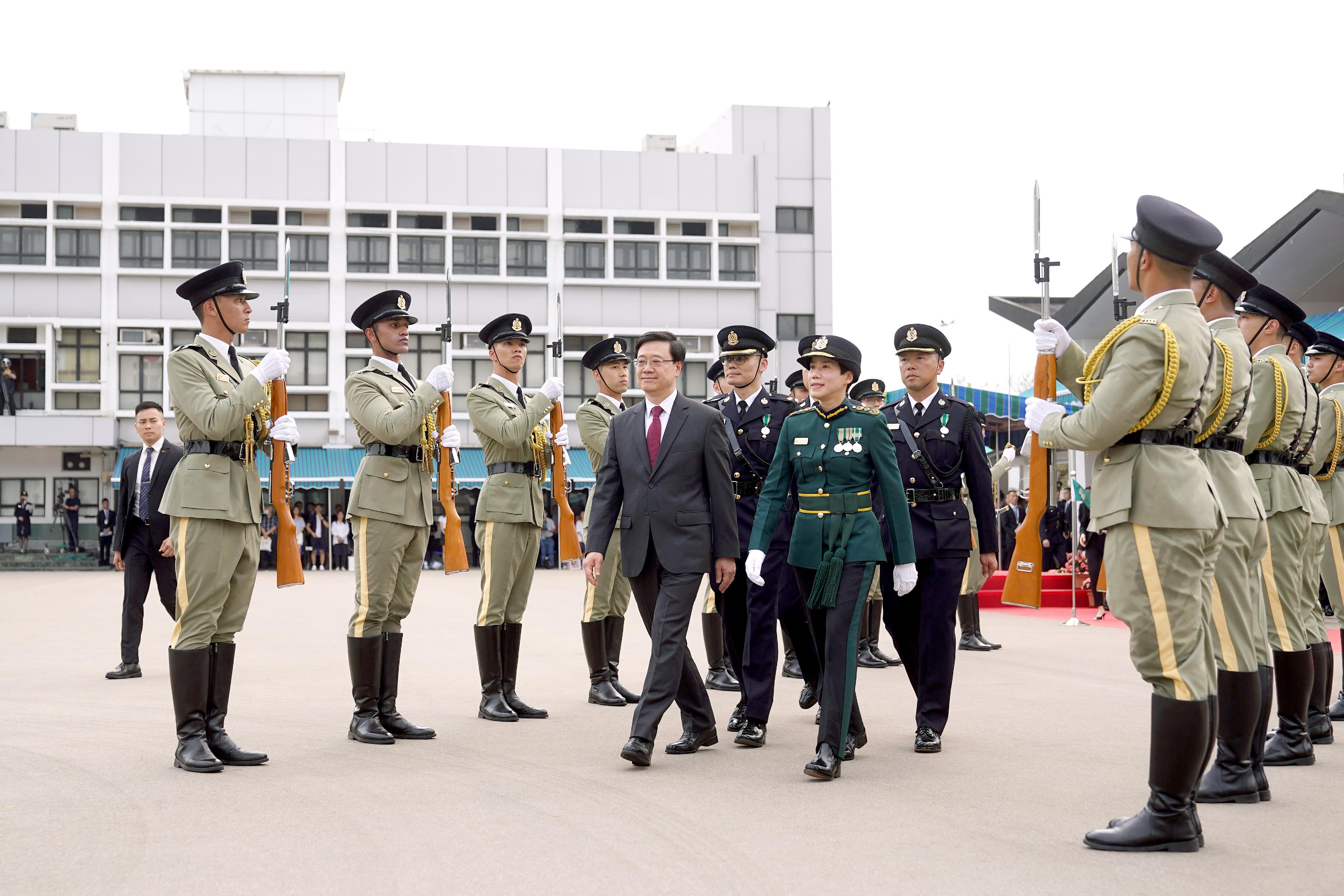 Hong Kong Customs Passing-out Parade was held today (March 24). Photo shows the Chief Executive, Mr John Lee (front row, left), inspecting the parade with the Commissioner of Customs and Excise, Ms Louise Ho (front row, right).