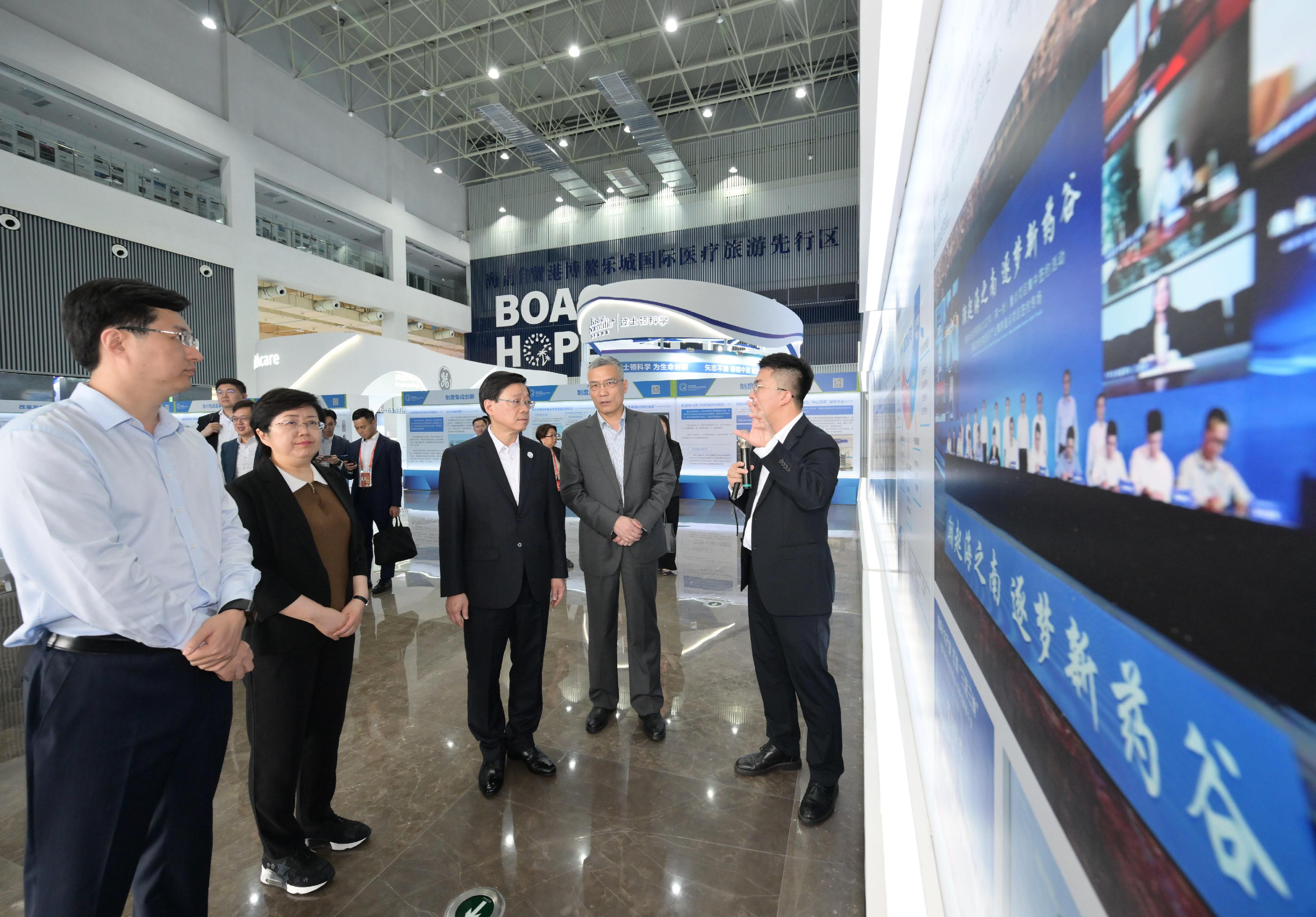 The Chief Executive, Mr John Lee, visited the Boao Lecheng International Medical Tourism Pilot Zone in Hainan today (March 29). Photo shows Mr Lee (centre), accompanied by the Standing Committee Member of the CPC Hainan Provincial Committee and Head of the United Front Work Department of the Hainan Committee of the CPC, Ms Miao Yanhong (second left), visiting the "Ever Lasting" International Innovative Medicine Equipment Exhibition in Hainan.
