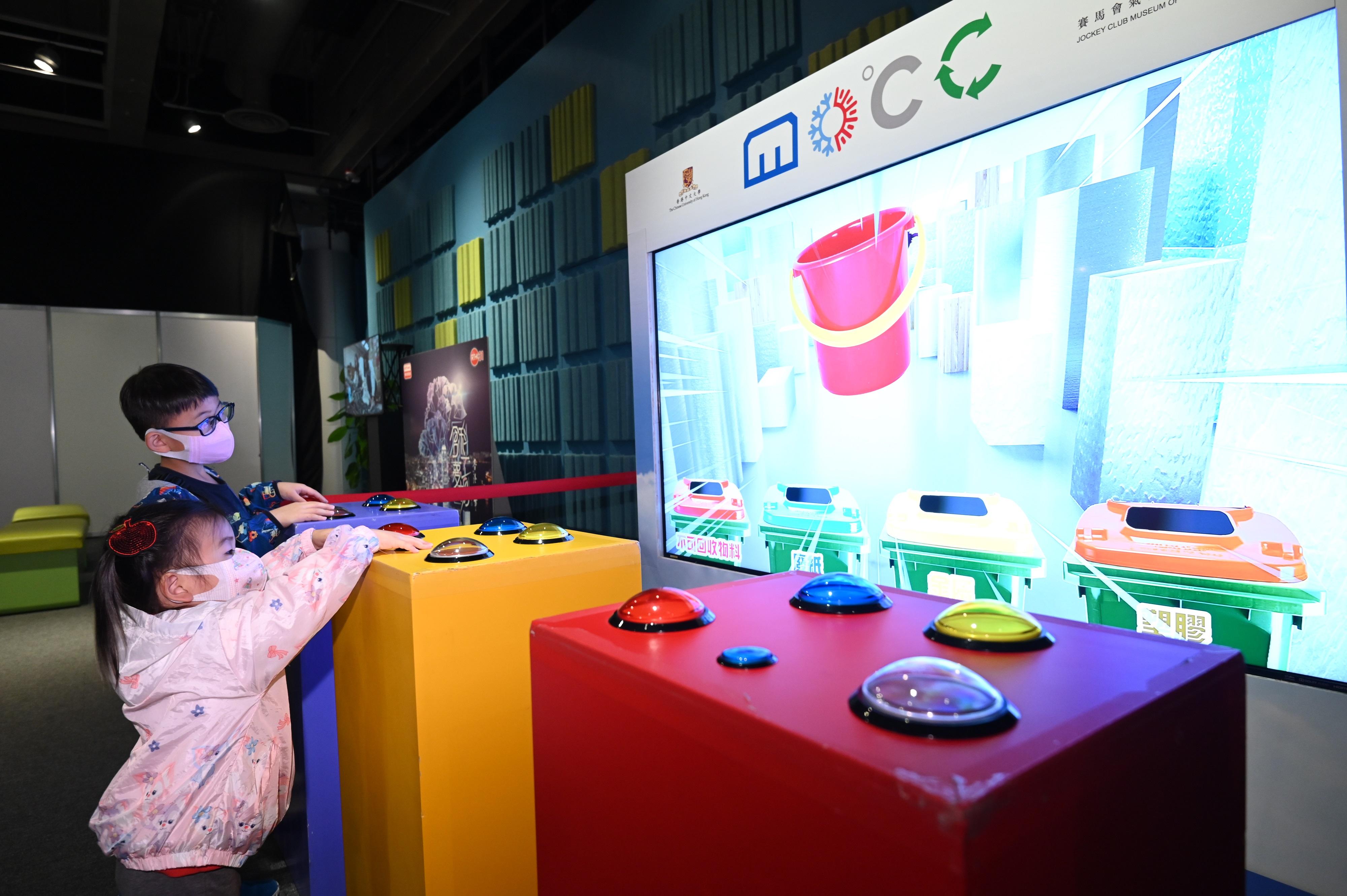 HK SciFest 2023, organised by the Science Promotion Unit of the Hong Kong Science Museum, will be held from today (March 31) to April 16 with the theme of "Science Around You". Photo shows children learning the fundamentals of climate change through multimedia interactive exhibits in the "Climate Action - Everyone Counts" exhibition at the Hong Kong Science Museum.