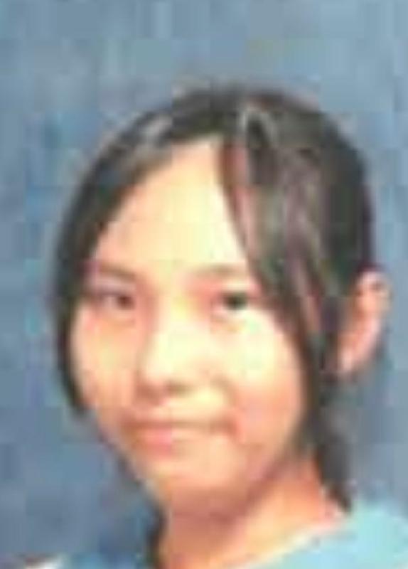 Cheung Ho-ying, aged 13, is about 1.55 metres tall, 55 kilograms in weight and of medium build. She has a round face with yellow complexion and long black hair. She was last seen wearing a black and white jacket, black trousers, black sports shoes and carrying a red backpack.
