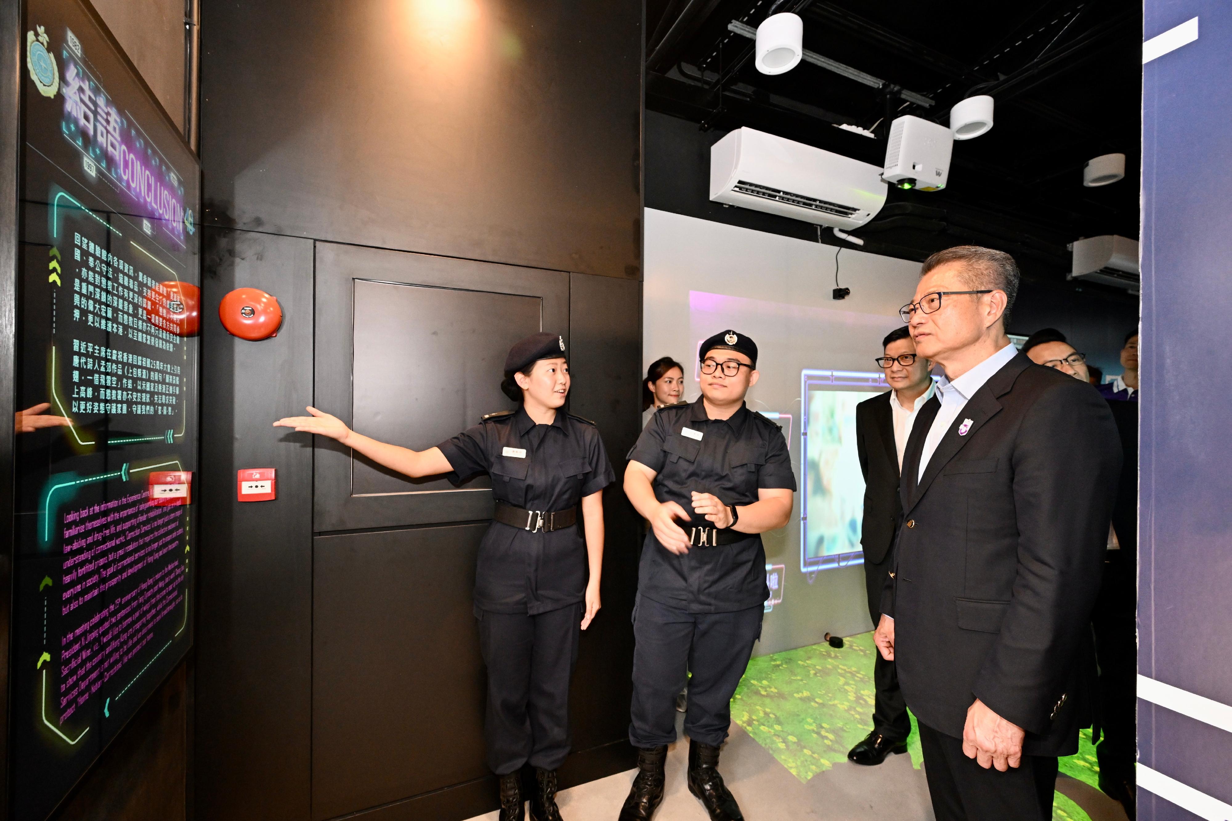 The Financial Secretary, Mr Paul Chan, attended the Safeguarding National Security Cup awards presentation ceremony today (April 15). Photo shows Mr Chan (first right), accompanied by the Secretary for Security, Mr Tang Ping-keung (second right), touring the Hong Kong Correctional Services Museum - Community Education Experience Centre.