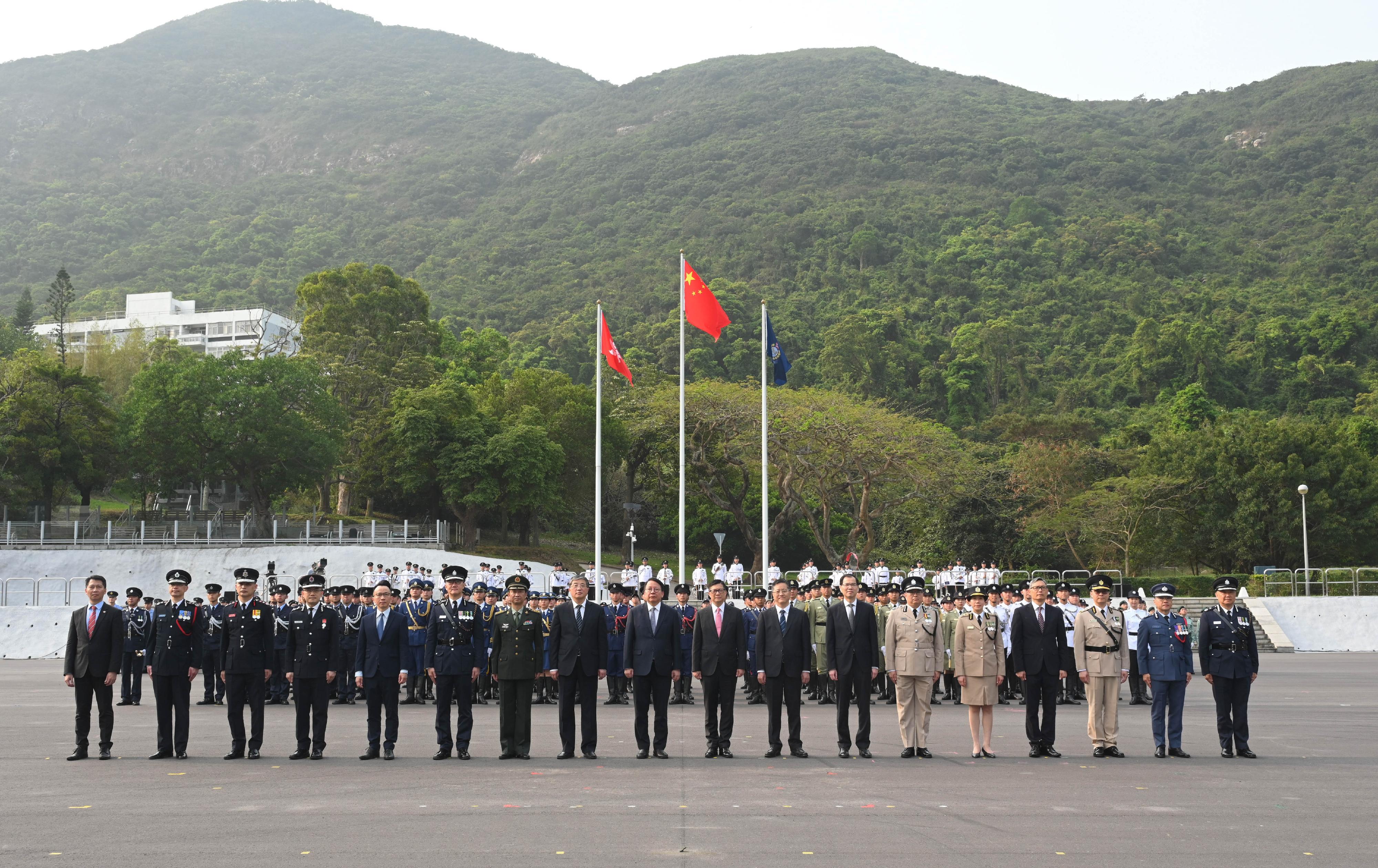 The Chief Secretary for Administration, Mr Chan Kwok-ki, attended the National Security Education Day flag raising ceremony today (April 15). Photo shows (from seventh left) the Deputy Chief of Staff of the Chinese People's Liberation Army Hong Kong Garrison, Mr Zhang Jun; Deputy Director of the Liaison Office of the Central People's Government in the Hong Kong Special Administrative Region (HKSAR) Mr Luo Yonggang; Mr Chan; the Secretary for Security, Mr Tang Ping-keung; Deputy Head of the Office for Safeguarding National Security of the Central People's Government in the HKSAR Mr Li Jiangzhou; the Secretary General of the Committee for Safeguarding National Security of the HKSAR, Mr Sonny Au; and heads of disciplined services departments and other officiating guests at the parade.