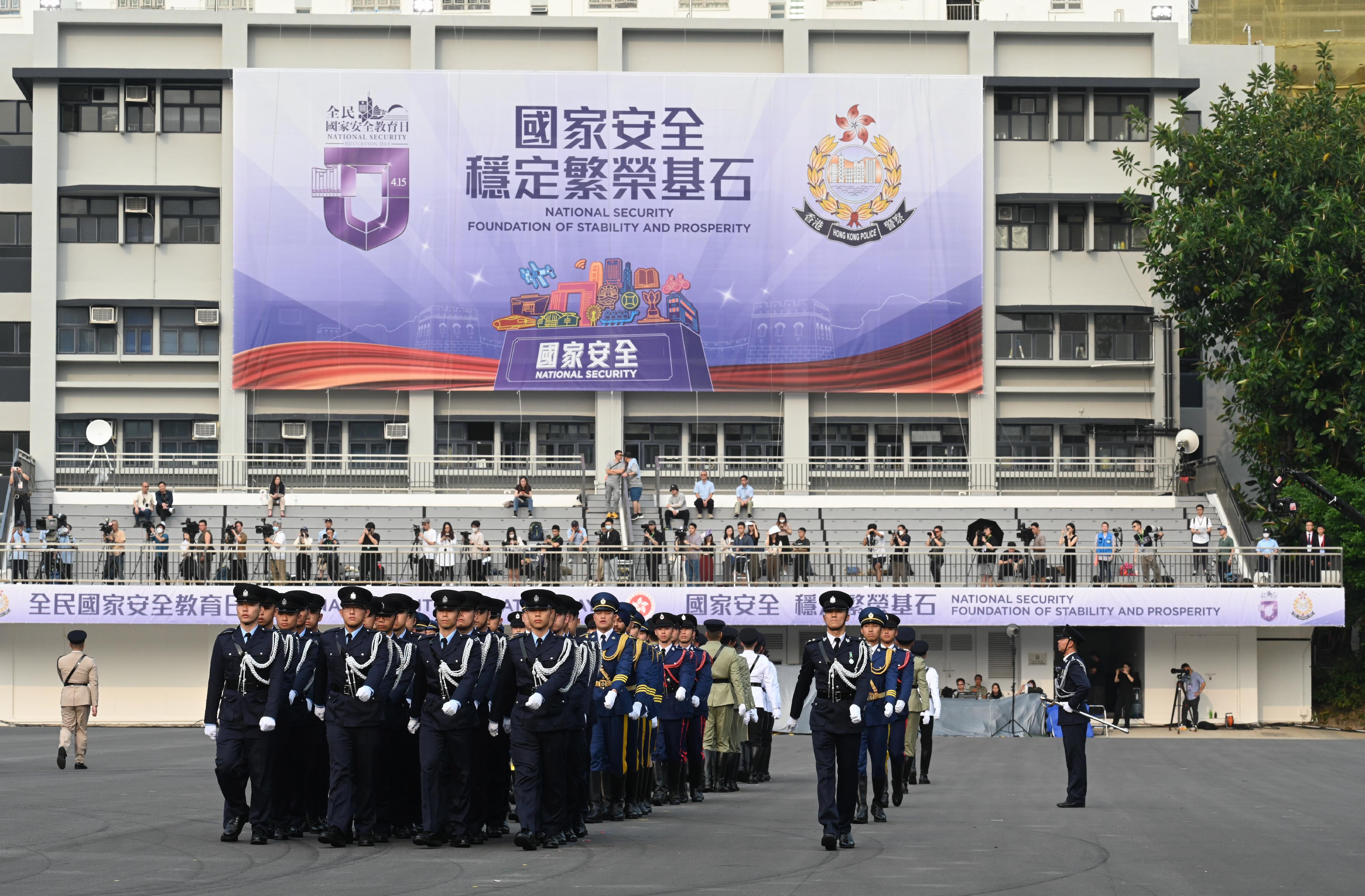 The Security Bureau and its disciplined services jointly held a National Security Education Day flag raising ceremony at the Hong Kong Police College today (April 15). Photo shows a march-in by the disciplined services ceremonial guard.