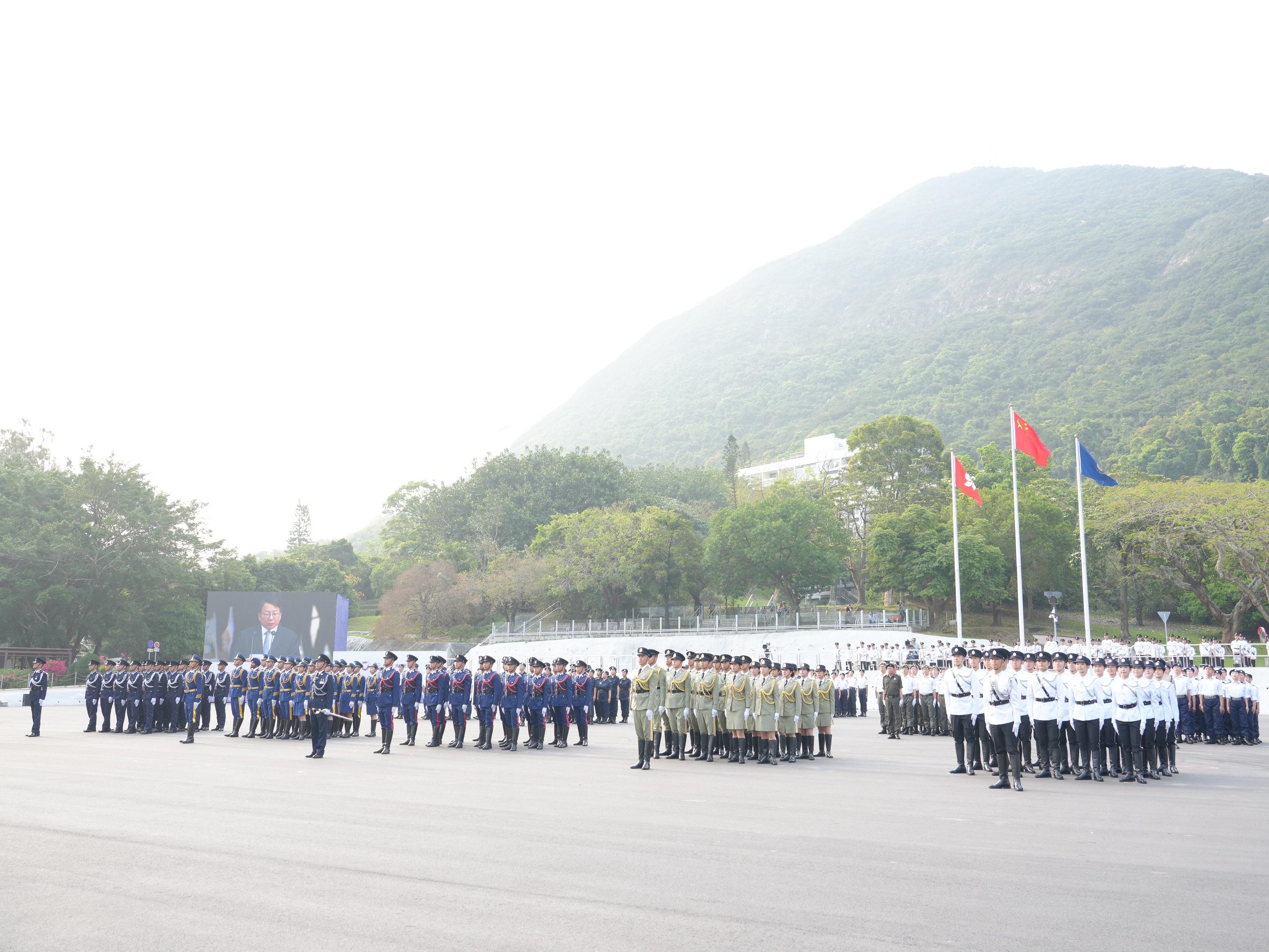 The Security Bureau and its disciplined services jointly held a National Security Education Day flag raising ceremony at the Hong Kong Police College today (April 15). Photo shows the disciplined services ceremonial guard and youth groups lining up at the flag raising ceremony.