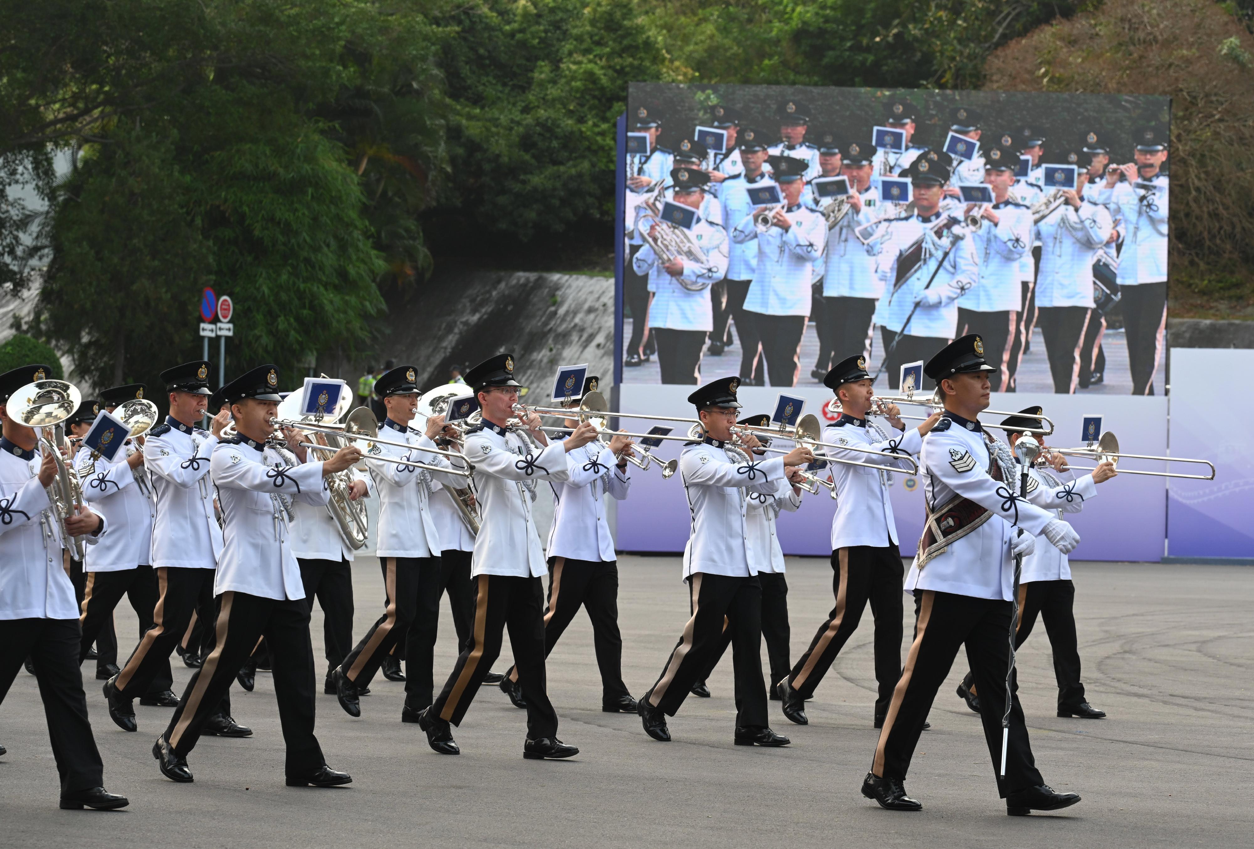 The Security Bureau and its disciplined services jointly held a National Security Education Day flag raising ceremony at the Hong Kong Police College today (April 15). Photo shows the Hong Kong Police Band conducting a performance to open the ceremony.