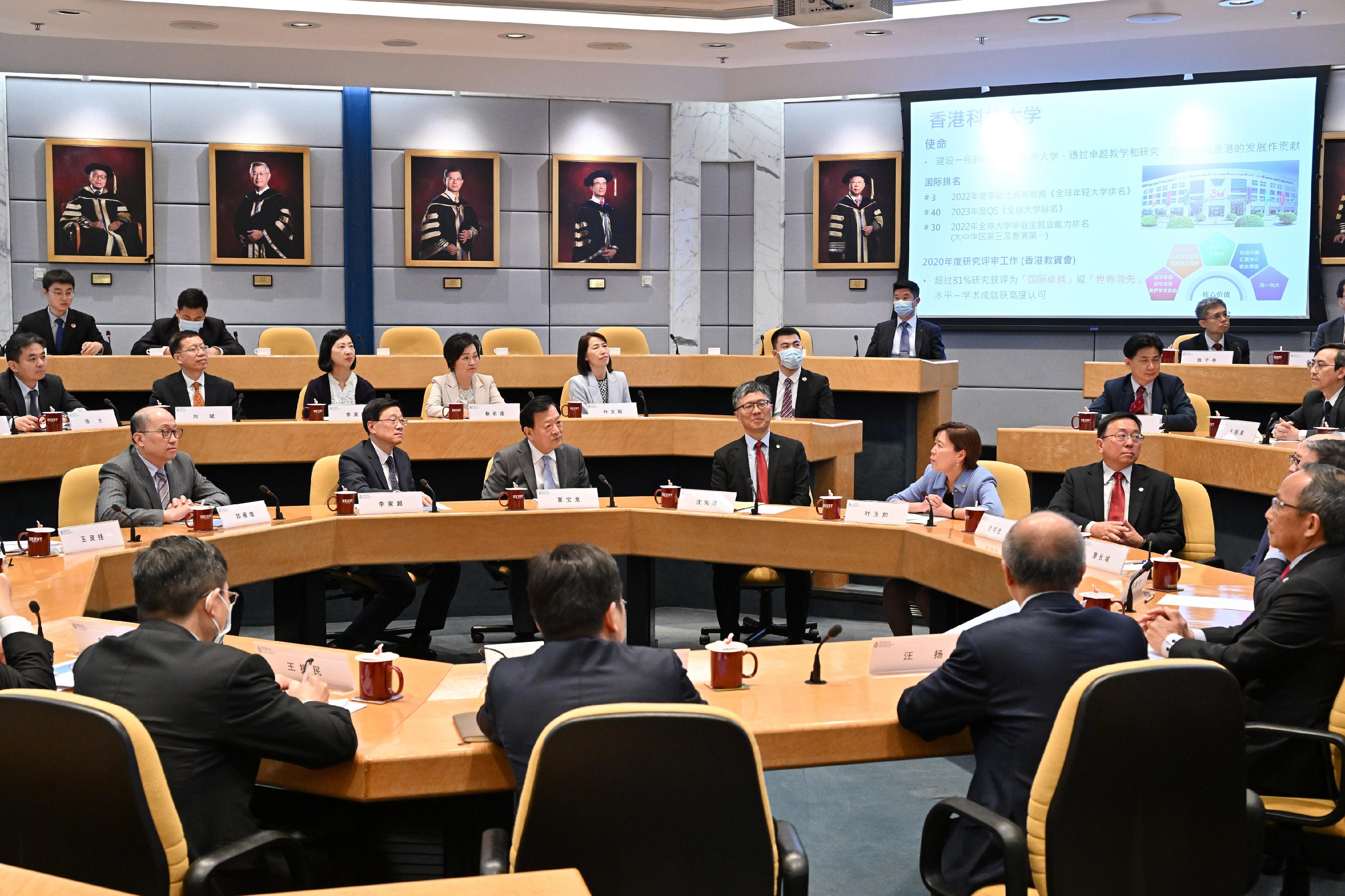 The Vice Chairman of the 13th Chinese People's Political Consultative Conference and Director of the Hong Kong and Macao Affairs Office of the State Council, Mr Xia Baolong, continued his visit in Hong Kong for a fifth day on April 17. Photo shows Mr Xia (front row, third left), accompanied by the Chief Executive, Mr John Lee (front row, second left), being briefed by the Council Chairman of the Hong Kong University of Science and Technology (HKUST), Professor Harry Shum (front row, third right), and the President of the HKUST, Professor Nancy Ip (front row, second right), on the development strategy of the University.