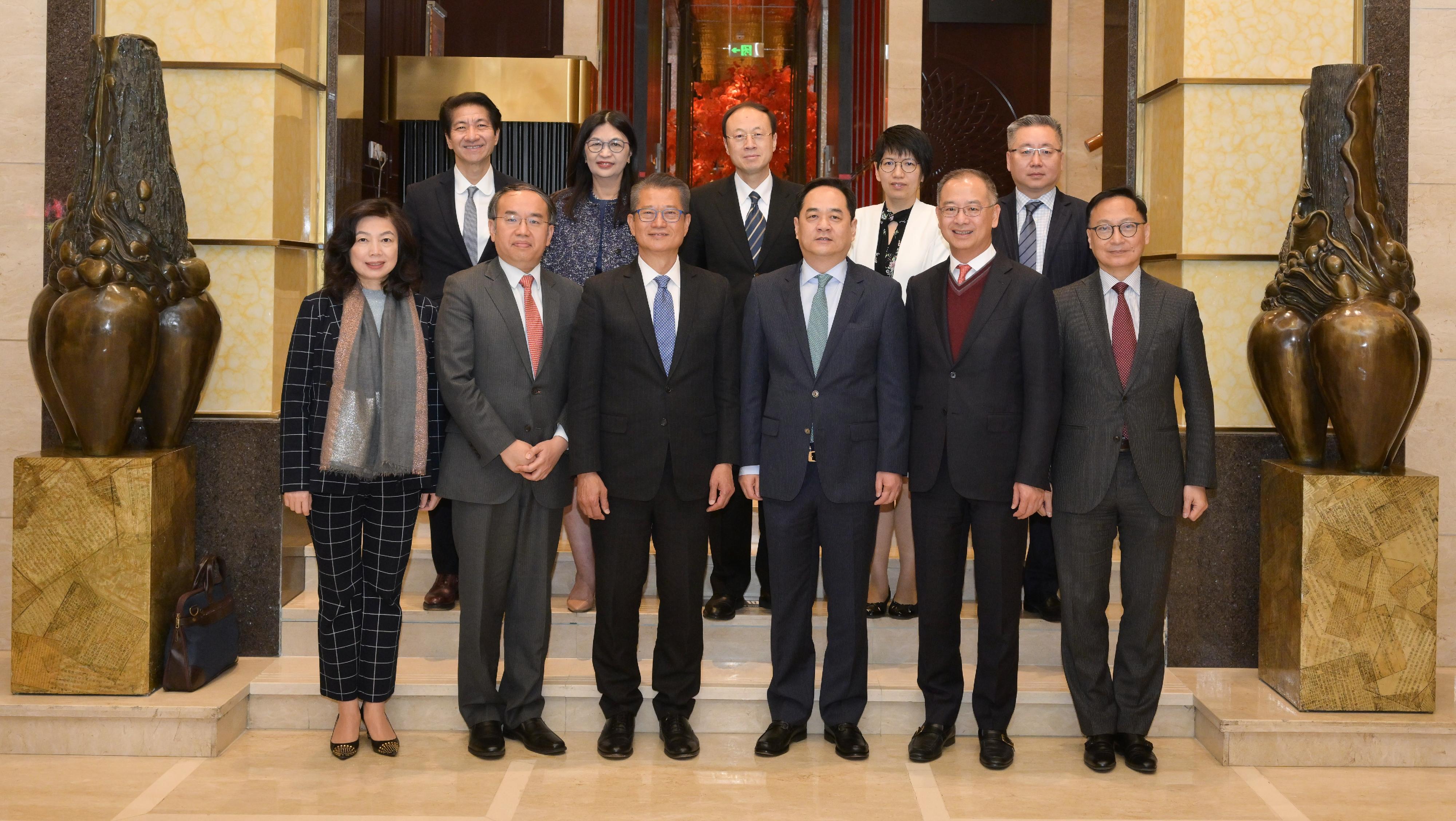 The Financial Secretary, Mr Paul Chan (front row, third left), concluded his visit to Beijing today (April 21). Accompanied by the Secretary for Financial Services and the Treasury, Mr Christopher Hui (front row, second left), Mr Chan called on Deputy Director of the Hong Kong and Macao Affairs Office of the State Council Mr Yang Wanming (front row, third right). The Permanent Secretary for Financial Services and the Treasury (Financial Services), Ms Salina Yan (front row, first left); the Chief Executive of the Hong Kong Monetary Authority, Mr Eddie Yue (front row, second right); the Chief Executive Officer of the Securities and Futures Commission, Ms Julia Leung (back row, second left); and the Chief Executive Officer of the Insurance Authority, Mr Clement Cheung (front row, first right), also attended.