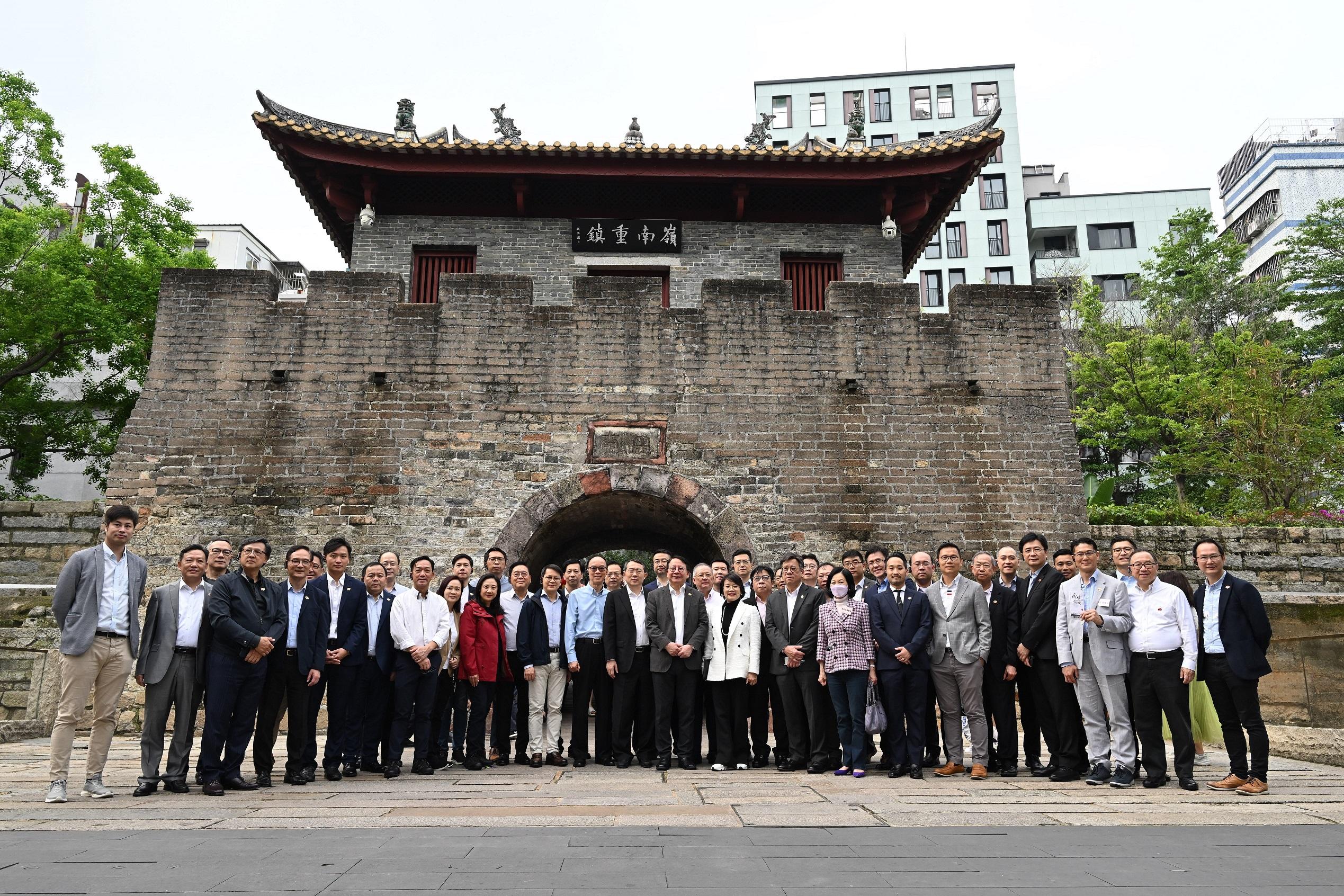 The delegation of the Hong Kong Special Administrative Region Government and the Legislative Council (LegCo) led by the Chief Executive, Mr John Lee, conducted their second-day visit in the Guangdong-Hong Kong-Macao Greater Bay Area today (April 22). Photo shows the Chief Secretary for Administration, Mr Chan Kwok-ki (first row, sixth right); Member of the Standing Committee of the Shenzhen Municipal Committee of the Communist Party of China and the Head of the United Front Work Department of the Shenzhen Municipal Committee of the Communist Party of China, Mr Wang Qiang (first row, seventh right); the Secretary for Commerce and Economic Development, Mr Algernon Yau (first  row, fourth right); the Secretary for Innovation, Technology and Industry, Professor Sun Dong (second row, seventh right), and LegCo Members visiting the Nantou Ancient Town.