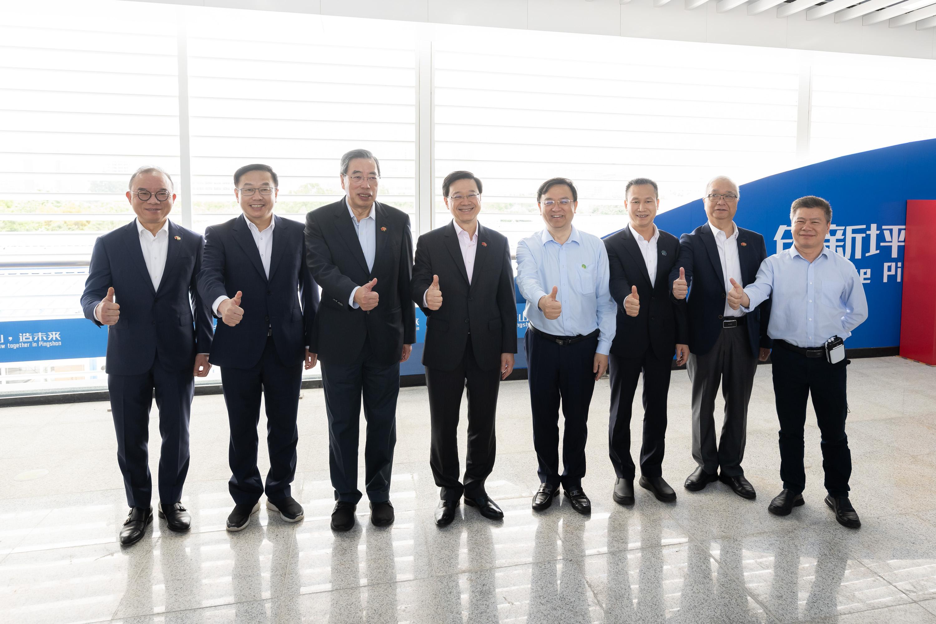 The delegation of the Hong Kong Special Administrative Region Government and the Legislative Council led by the Chief Executive, Mr John Lee, continues its duty visit in the Guangdong-Hong Kong-Macao Greater Bay Area today (April 22). Photo shows Mr Lee (fourth left); the President of LegCo, Mr Andrew Leung (third left); the Founder and President of BYD Company Limited, Mr Wang Chuanfu (fourth right); and other delegation members posing for a group photo at the headquarters of BYD Company Limited.