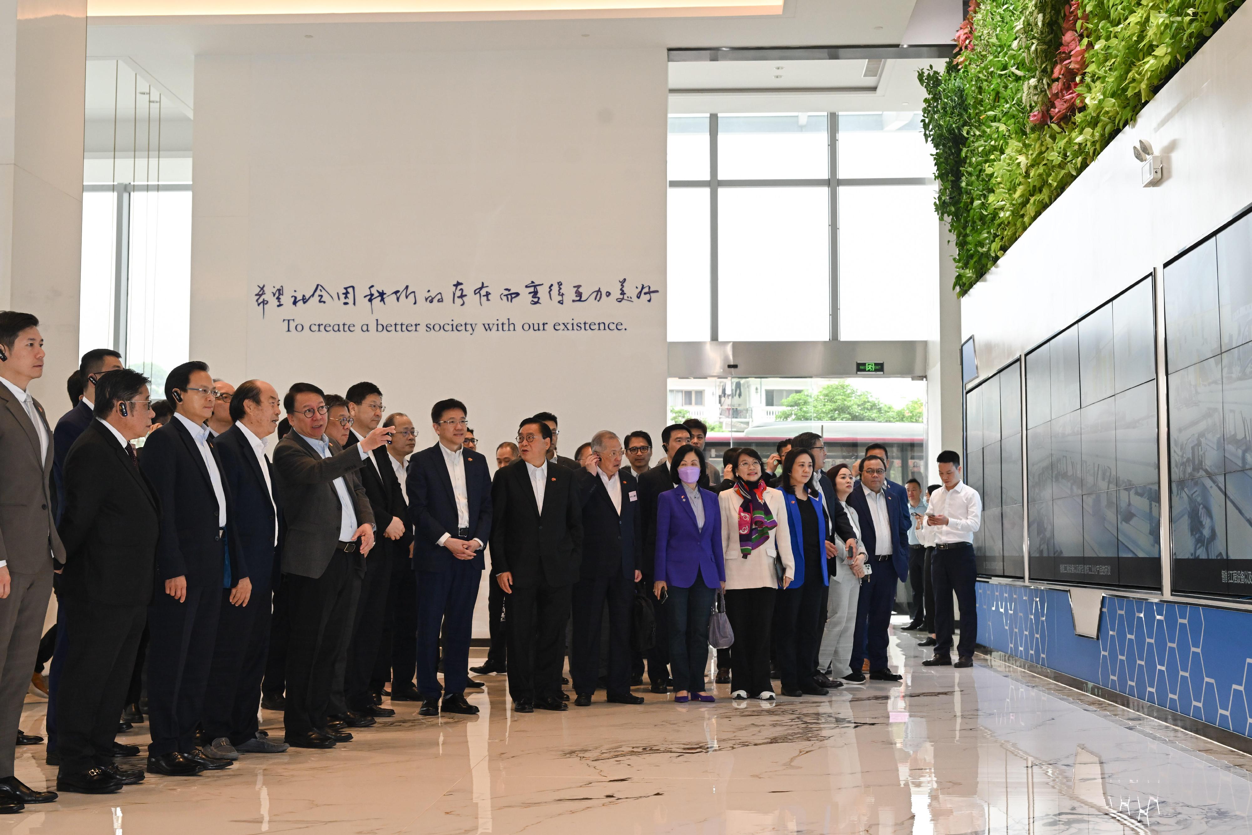 The delegation of the Hong Kong Special Administrative Region Government and the Legislative Council (LegCo) led by the Chief Executive, Mr John Lee, conducted their third-day visit in the Guangdong-Hong Kong-Macao Greater Bay Area today (April 23). Photo shows the Chief Secretary for Administration, Mr Chan Kwok-ki (front row, fifth left); the founder of the Country Garden Group, Mr Yang Guoqiang (front row, fourth left); the Secretary for Commerce and Economic Development, Mr Algernon Yau (front row, sixth left); the Secretary for Innovation, Technology and Industry, Professor Sun Dong (front row, eighth left); and LegCo members visiting the Guangdong Bright Dream Robotics Co Ltd in Foshan.