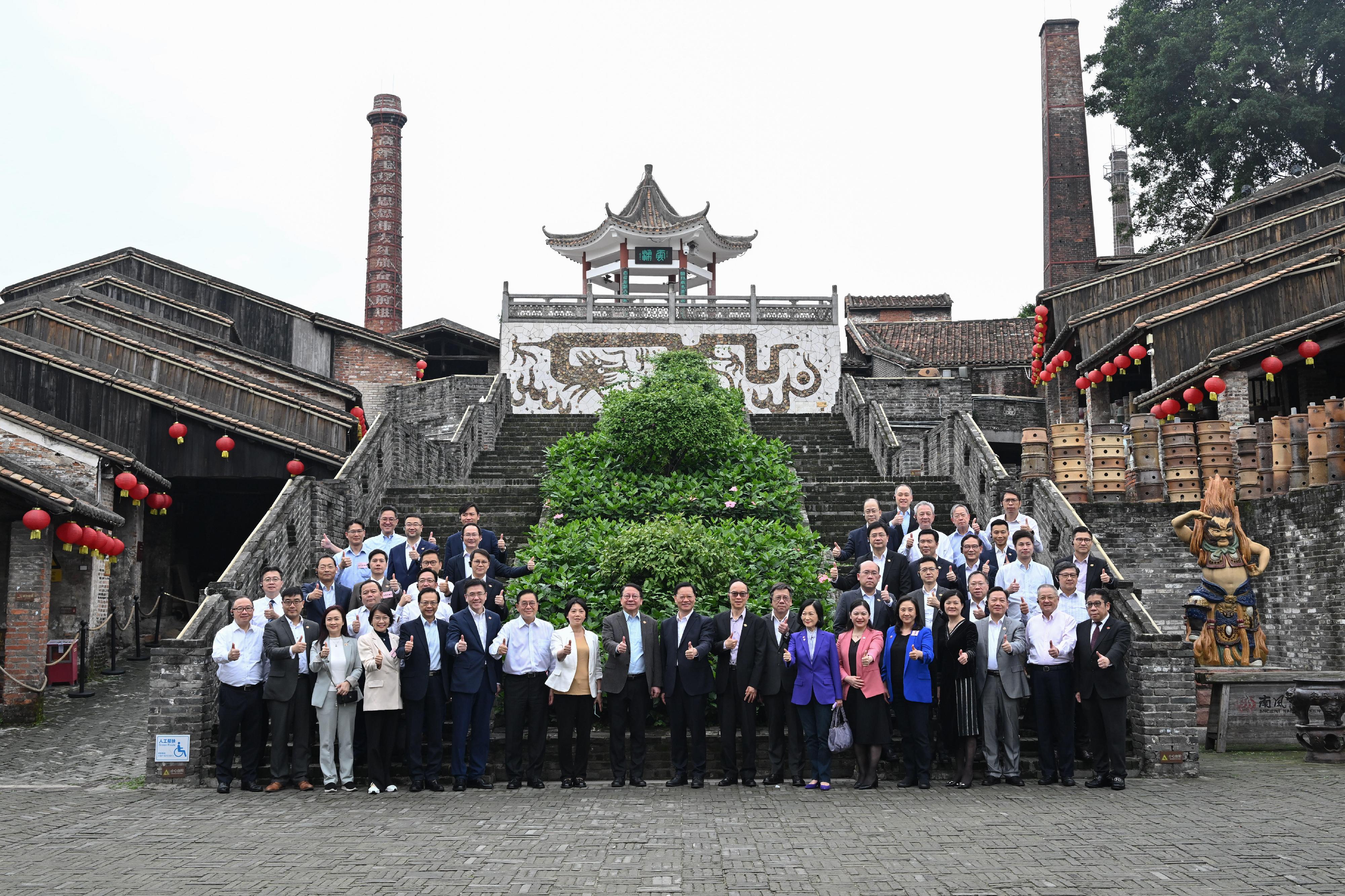 The delegation of the Hong Kong Special Administrative Region Government and the Legislative Council (LegCo) led by the Chief Executive, Mr John Lee, conducted their third-day visit in the Guangdong-Hong Kong-Macao Greater Bay Area today (April 23). Photo shows the Chief Secretary for Administration, Mr Chan Kwok-ki (front row, ninth left); Member of the Standing Committee of the Foshan Municipal Committee of the Communist Party of China and the Head of the United Front Work Department of the Foshan Municipal Committee of the Communist Party of China, Mr Ding Xifeng (front row, centre); the Secretary for Commerce and Economic Development, Mr Algernon Yau (front row, eighth right); the Secretary for Innovation, Technology and Industry, Professor Sun Dong (front row, sixth left), and LegCo members at the Ancient Nanfeng Kiln.