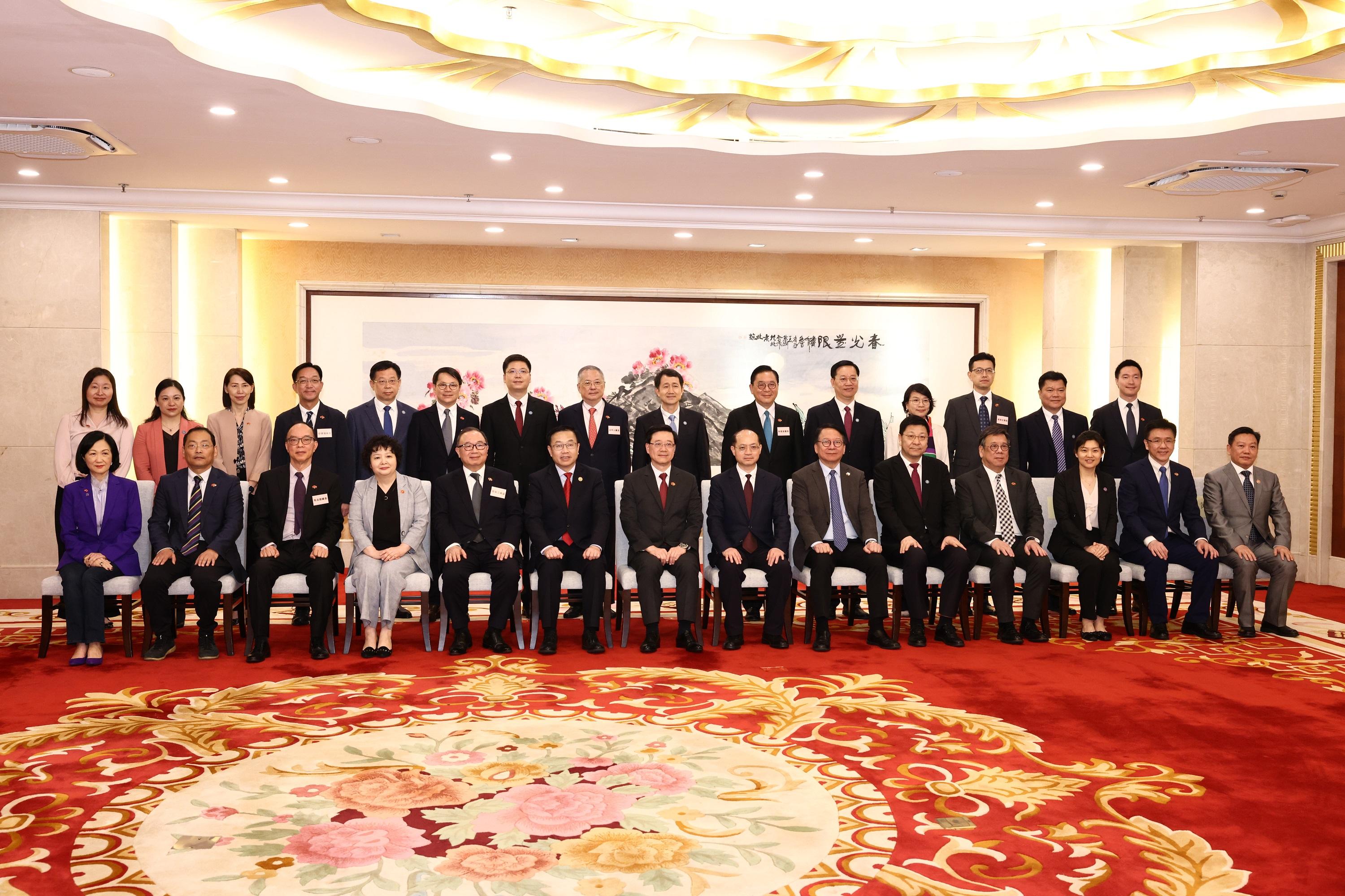 The Chief Executive, Mr John Lee, led a delegation of the Hong Kong Special Administrative Region Government and the Legislative Council (LegCo) to visit Guangdong-Hong Kong-Macao Greater Bay Area in Foshan today (April 23). Photo shows Mr Lee (seventh left); Deputy Director of the Liaison Office of the Central People's Government in the Hong Kong Special Administrative Region Mr He Jing (sixth left); the Secretary of the CPC Foshan Municipal Party Committee, Mr Zheng Ke (seventh right), Mayor of the Foshan Municipal Government, Mr Bai Tao (fifth right); the Director General of the Hong Kong and Macao Affairs Office of the People's Government of Guangdong Province, Ms Li Huanchun (fourth left); the Chief Secretary for Administration, Mr Chan Kwok-ki (sixth right); the Secretary for Commerce and Economic Development, Mr Algernon Yau (fourth right); the Secretary for Innovation, Technology and Industry, Professor Sun Dong (second right), LegCo members and other guests at the dinner with leaders of Foshan Municipal Government.