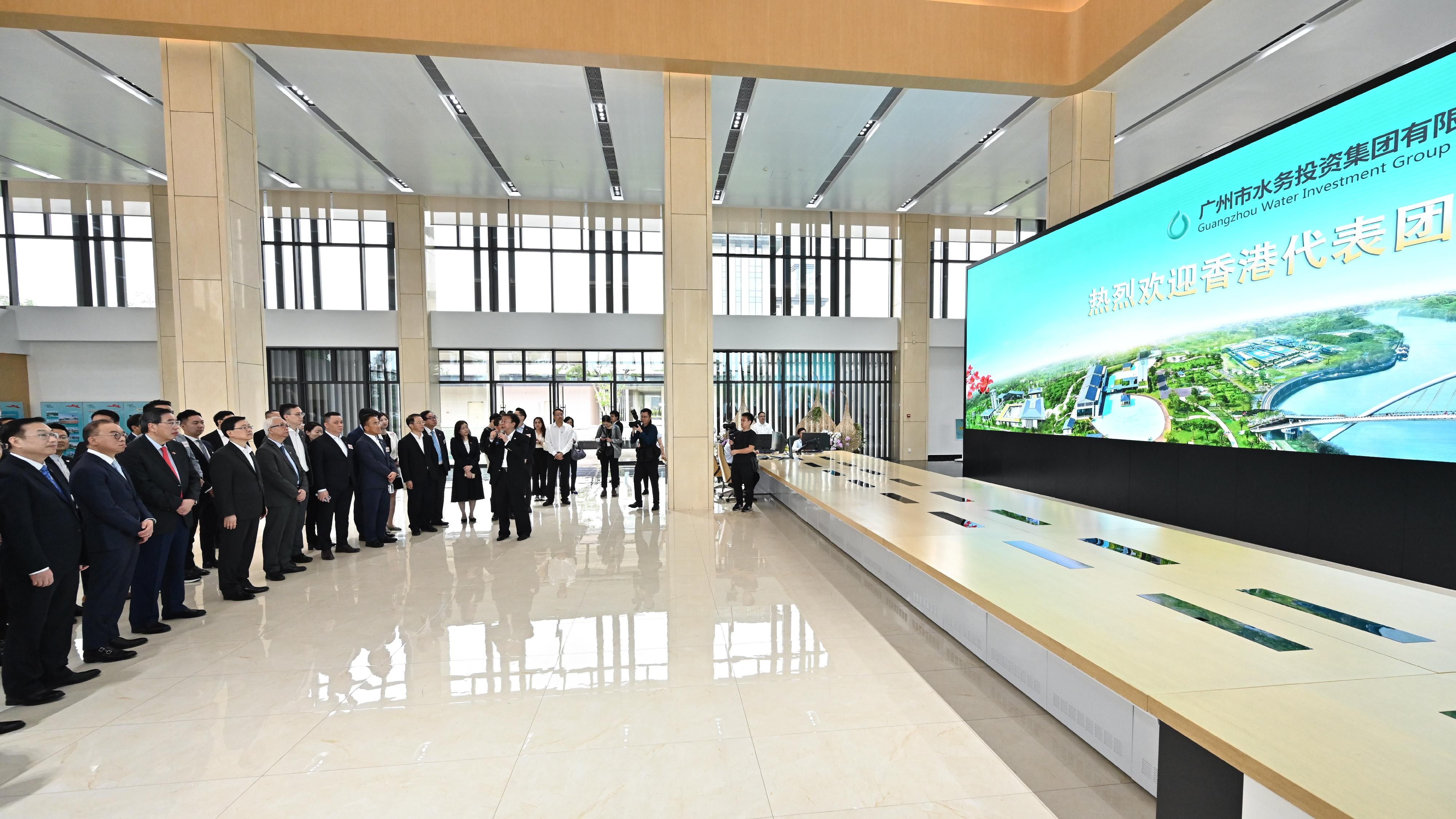 The Chief Executive, Mr John Lee, led a delegation of the Hong Kong Special Administrative Region Government and the Legislative Council to visit Guangdong-Hong Kong-Macao Greater Bay Area in Guangzhou today (April 24). Photo shows Mr Lee (fourth left) and members of the delegation visiting the Lijiao sewage treatment plant  and watching an introduction video.
