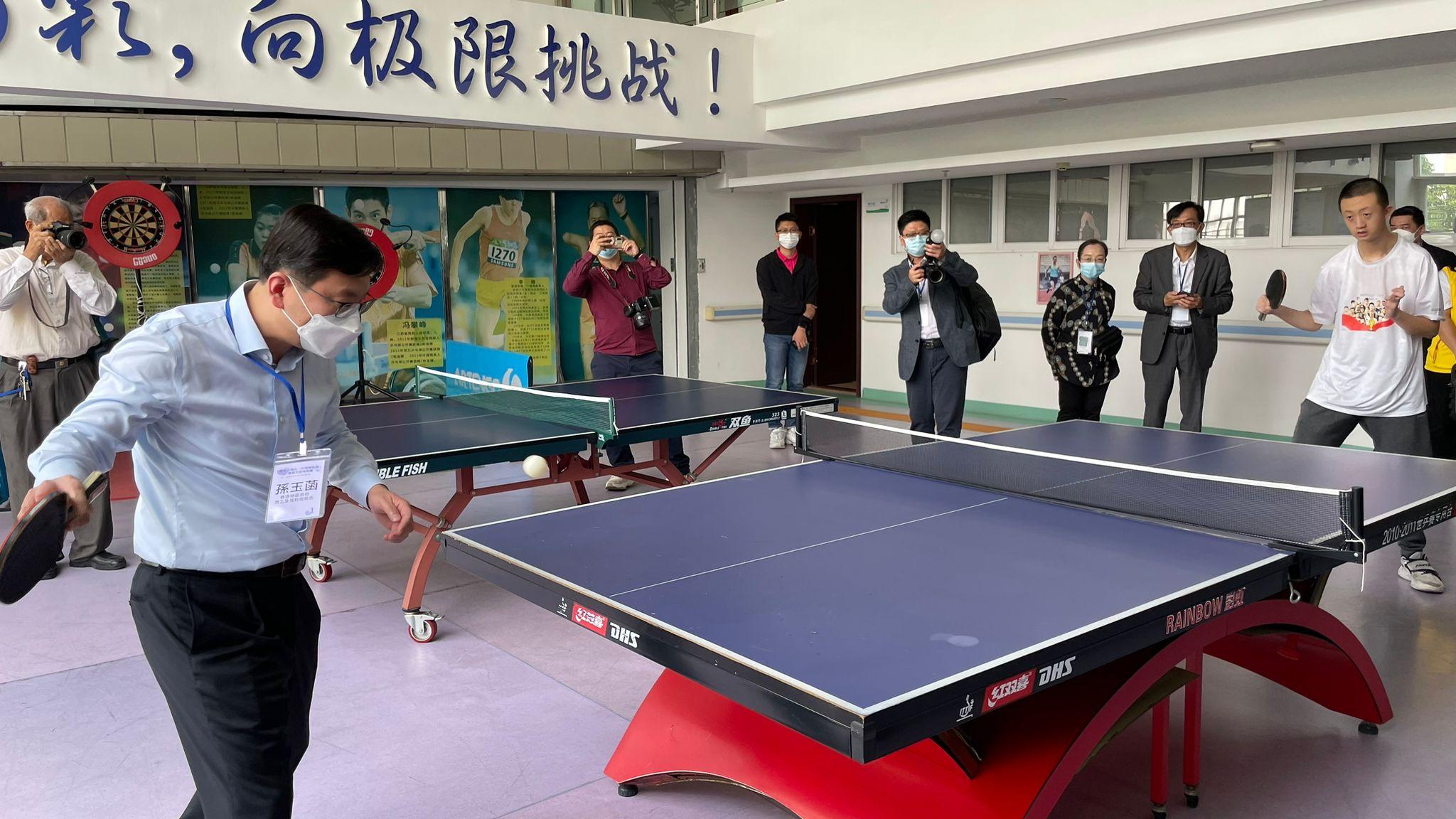 The Secretary for Labour and Welfare, Mr Chris Sun, led the Hong Kong social welfare sector delegation on a visit to Guangdong and visited a rehabilitation centre in Zhongshan Municipality this afternoon (April 26). Photo shows Mr Sun (left, front) playing table tennis with a person with a disability.
