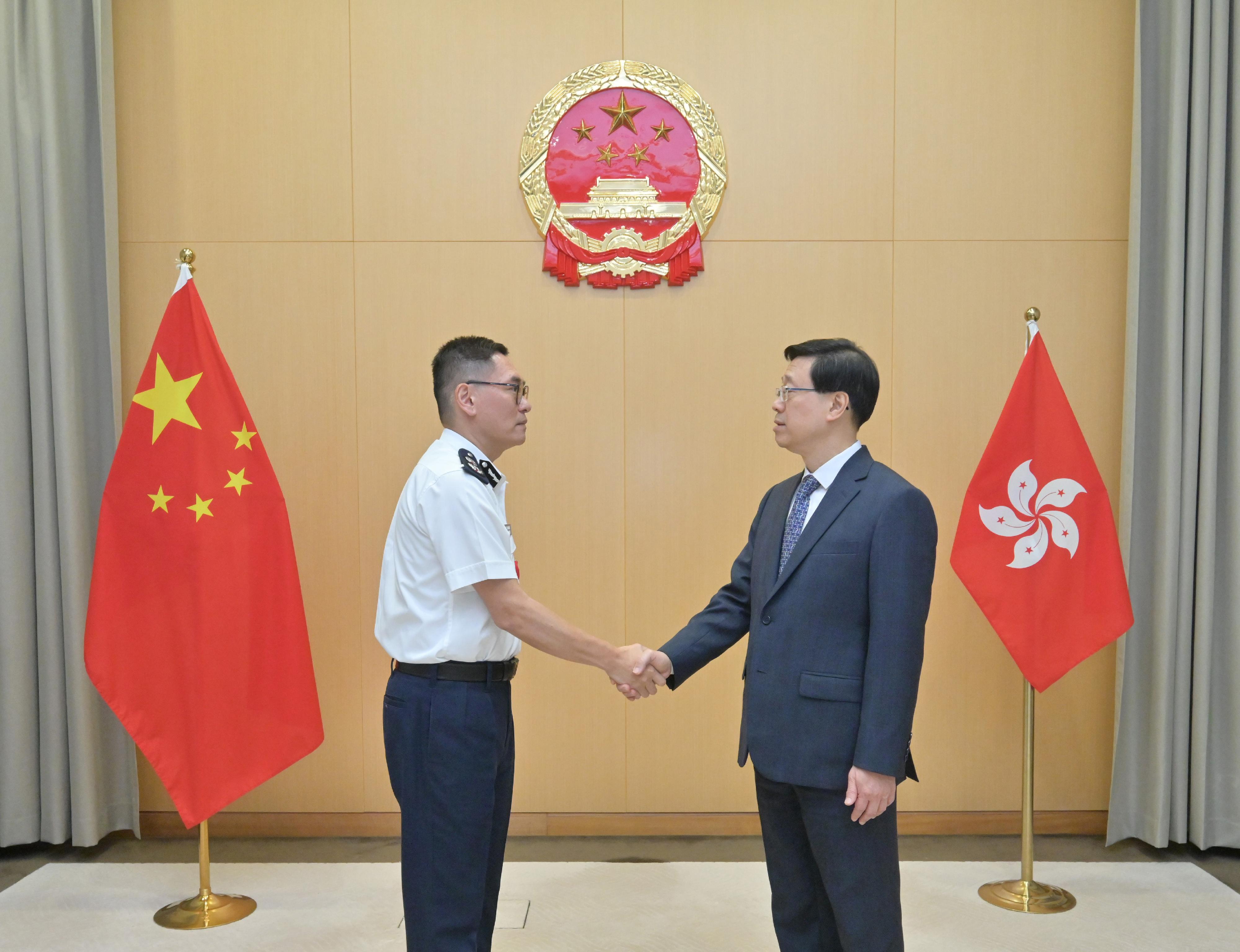 The Chief Executive, Mr John Lee (right), is pictured with the Deputy Commissioner of Police (National Security), Mr Kan Kai-yan (left), today (May 2).