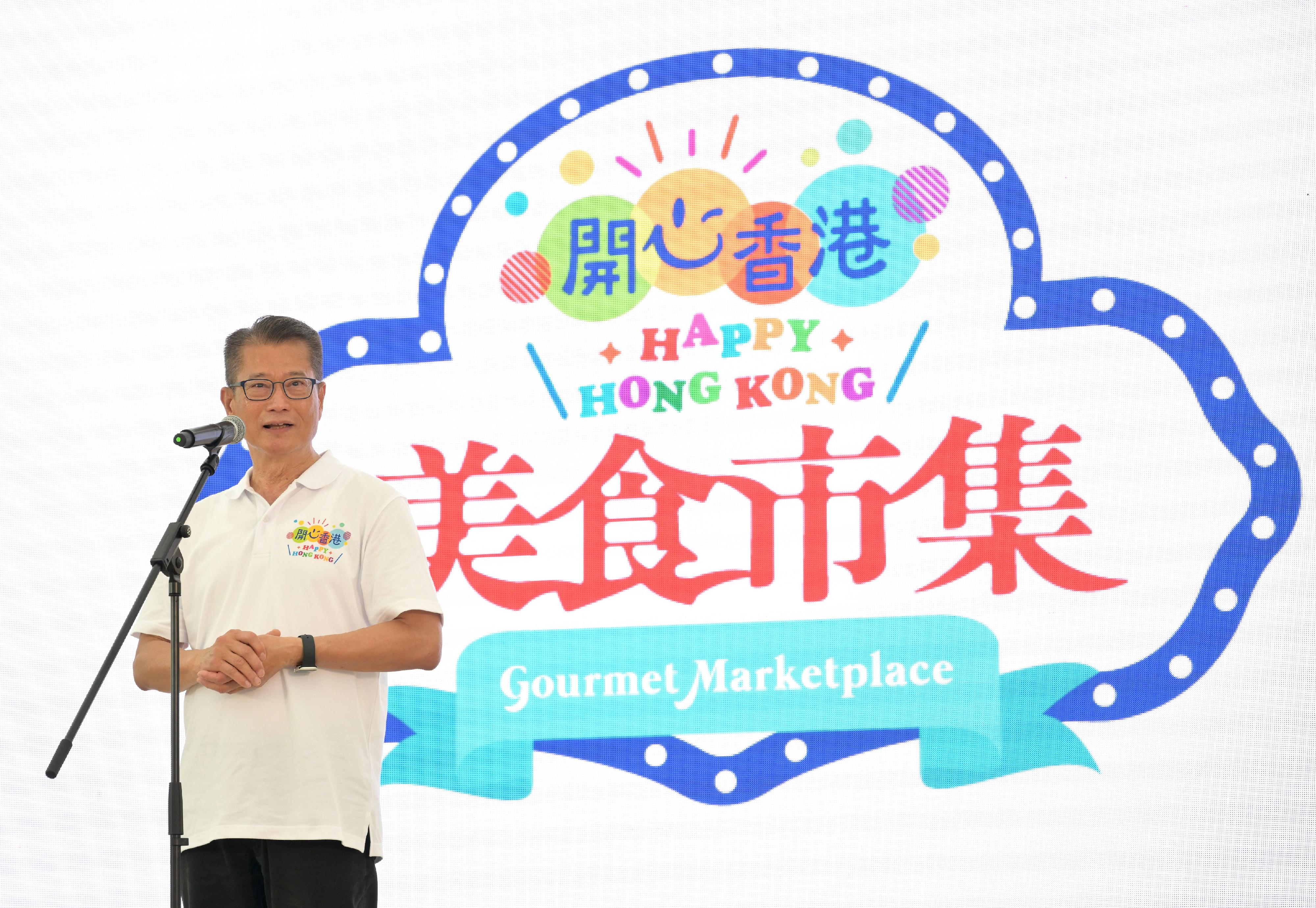 The Financial Secretary, Mr Paul Chan, speaks at the opening ceremony of the second "Happy Hong Kong" Gourmet Marketplace today (May 6).