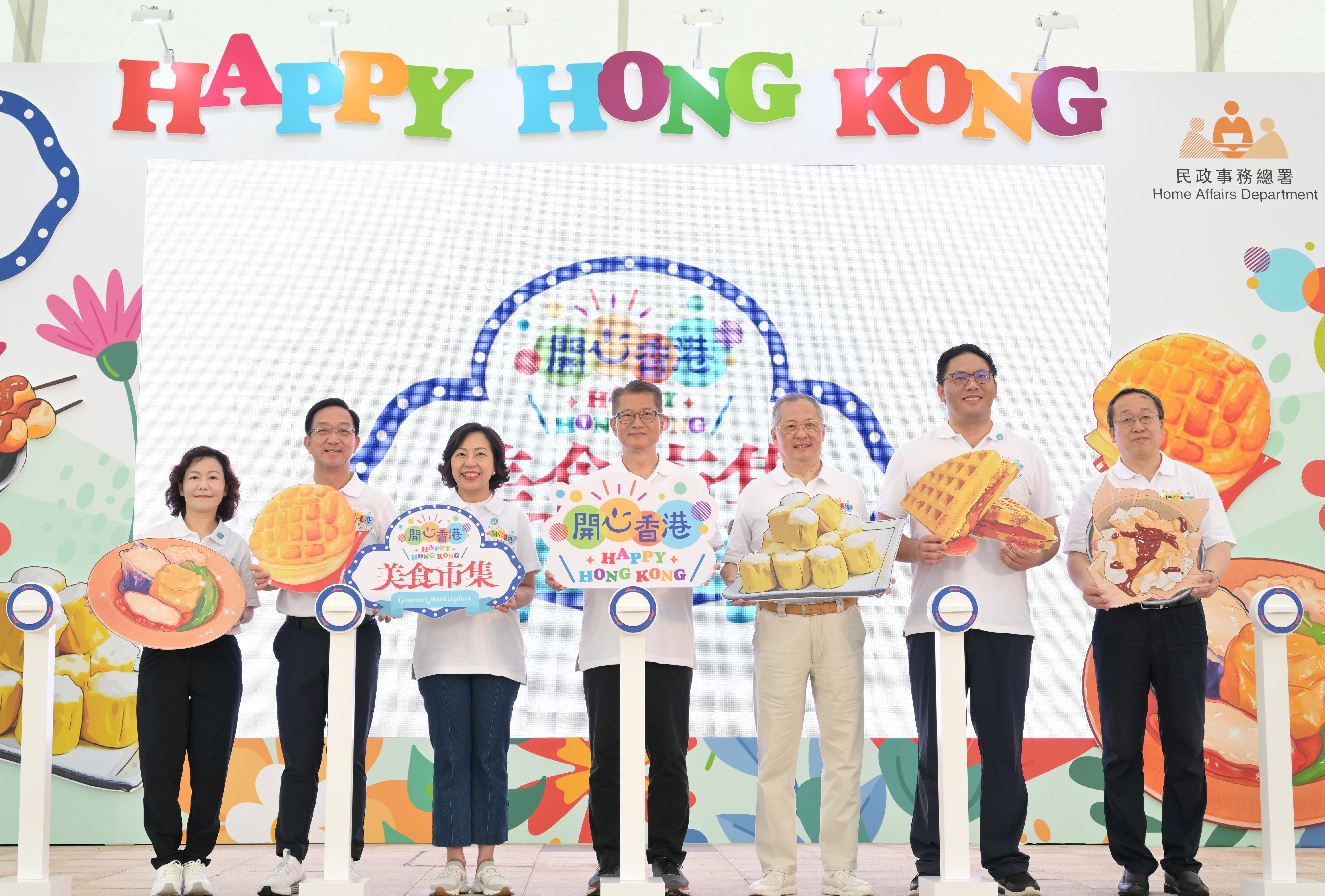 The Financial Secretary, Mr Paul Chan, officiated at the opening ceremony of the second "Happy Hong Kong" Gourmet Marketplace today (May 6). Photo shows (from left) the Director of Home Affairs, Mrs Alice Cheung; 
Legislative Council (LegCo) Member (Heung Yee Kuk), the Chairman of New Territories Heung Yee Kuk Mr Kenneth Lau; the Secretary for Home and Youth Affairs, Miss Alice Mak; Mr Chan; Non-official Member of the Executive Council, LegCo Member (Catering) Mr Tommy Cheung; the Under Secretary for Home and Youth Affairs, Mr Clarence Leung; and Vice-Chairman and President of the Hong Kong Chinese Enterprises Association Mr Yu Xiao officiating at the ceremony.