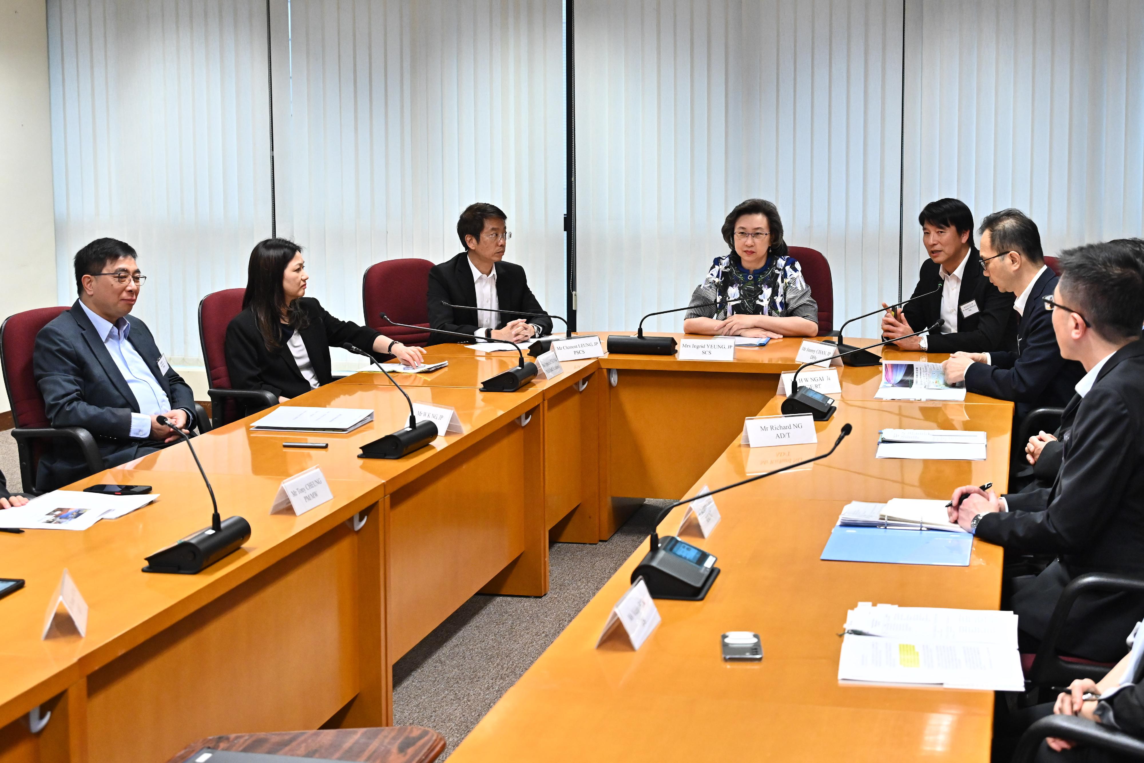 The Secretary for the Civil Service, Mrs Ingrid Yeung, visited the headquarters of the Highways Department today (May 8). Photo shows Mrs Yeung (fourth left) being briefed by the Director of Highways, Mr Jimmy Chan (fifth left), and the directorate staff on the department's latest developments. Looking on is the Permanent Secretary for the Civil Service, Mr Clement Leung (third left).