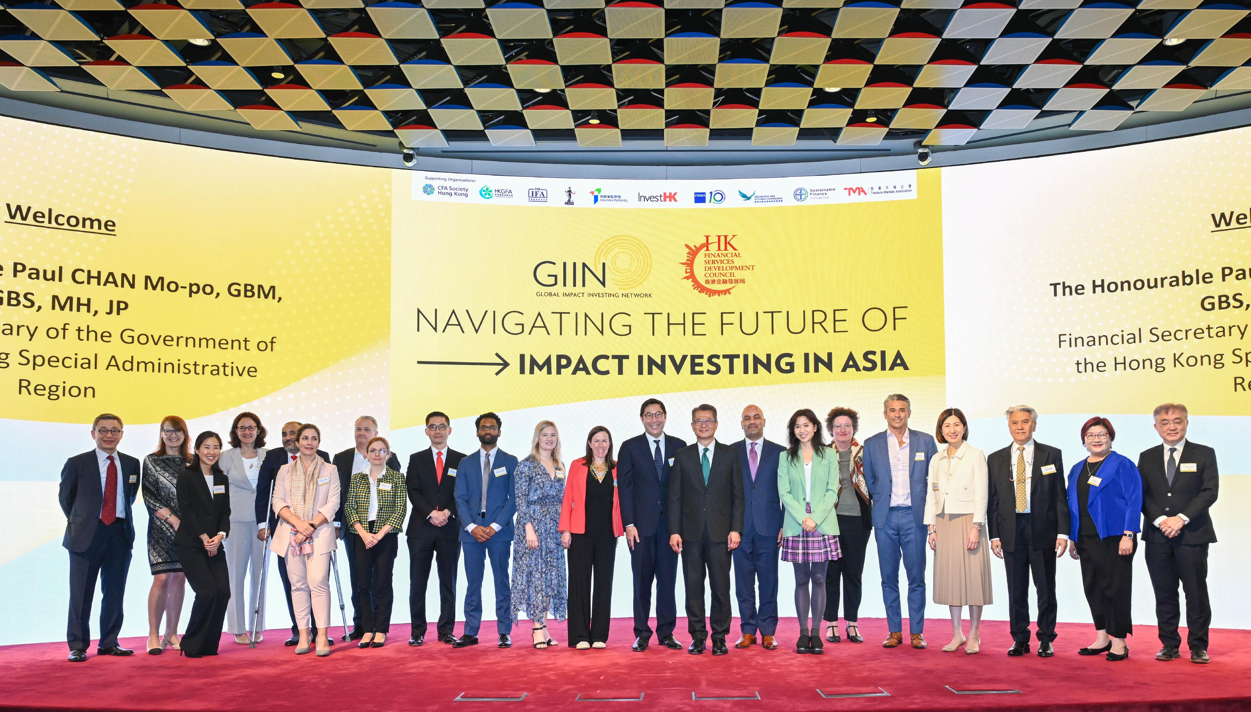 The Financial Secretary, Mr Paul Chan, attended the Navigating the Future of Impact Investing in Asia conference co-hosted by the Financial Services Development Council (FSDC) and the Global Impact Investing Network (GIIN) today (May 9). Photo shows Mr Chan (ninth right); the Chairman of the FSDC, Mr Laurence Li, SC (10th right); the Chief Executive Officer and Co-Founder of the GIIN Mr Amit Bouri (eighth right), and other guests at the conference.