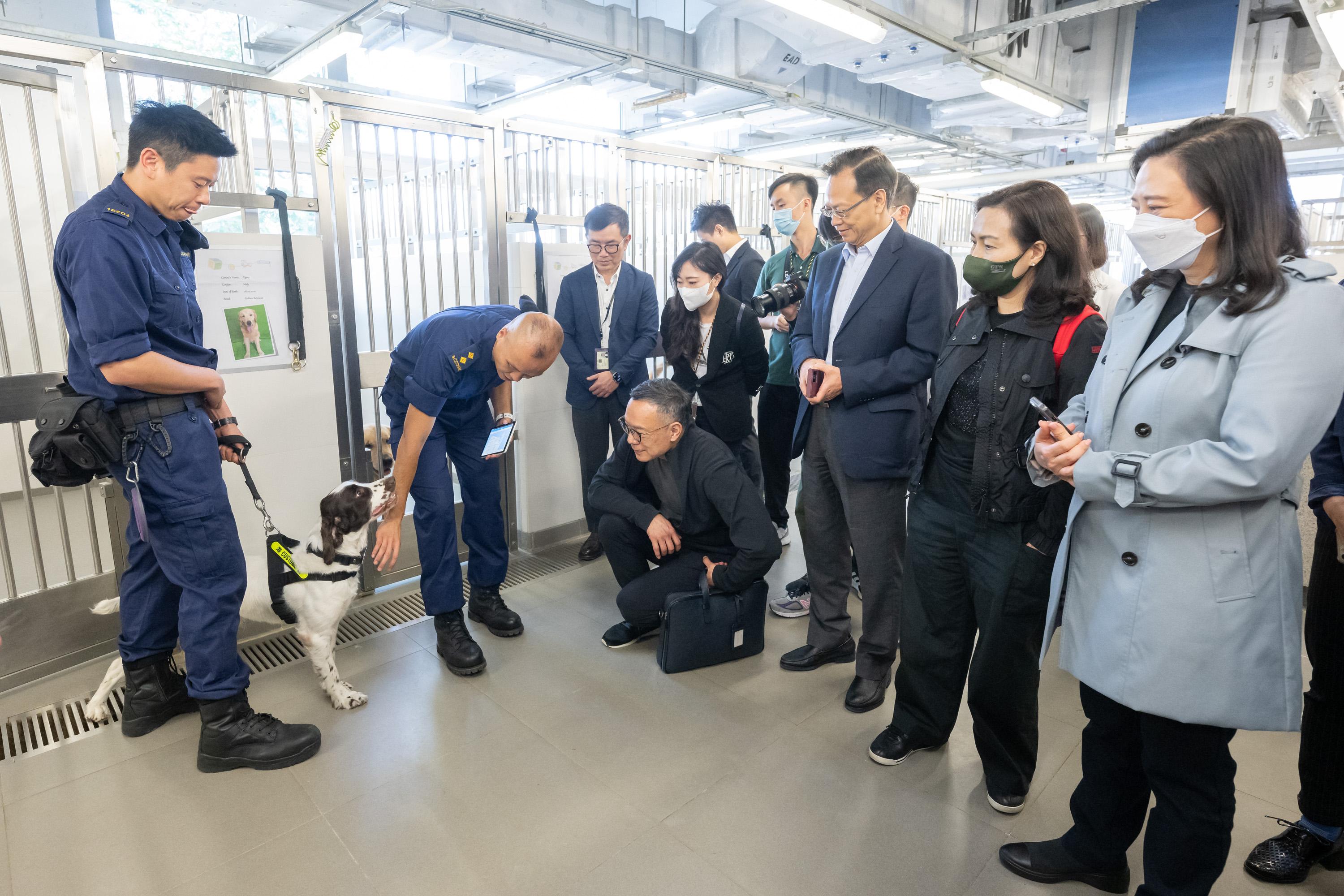 The Legislative Council (LegCo) Panel on Security visited facilities of two disciplined services today (May 9). Photo shows LegCo Members visiting the detector dog kennel in the Base of the Customs Canine Force at the Hong Kong-Zhuhai-Macao Bridge Base.