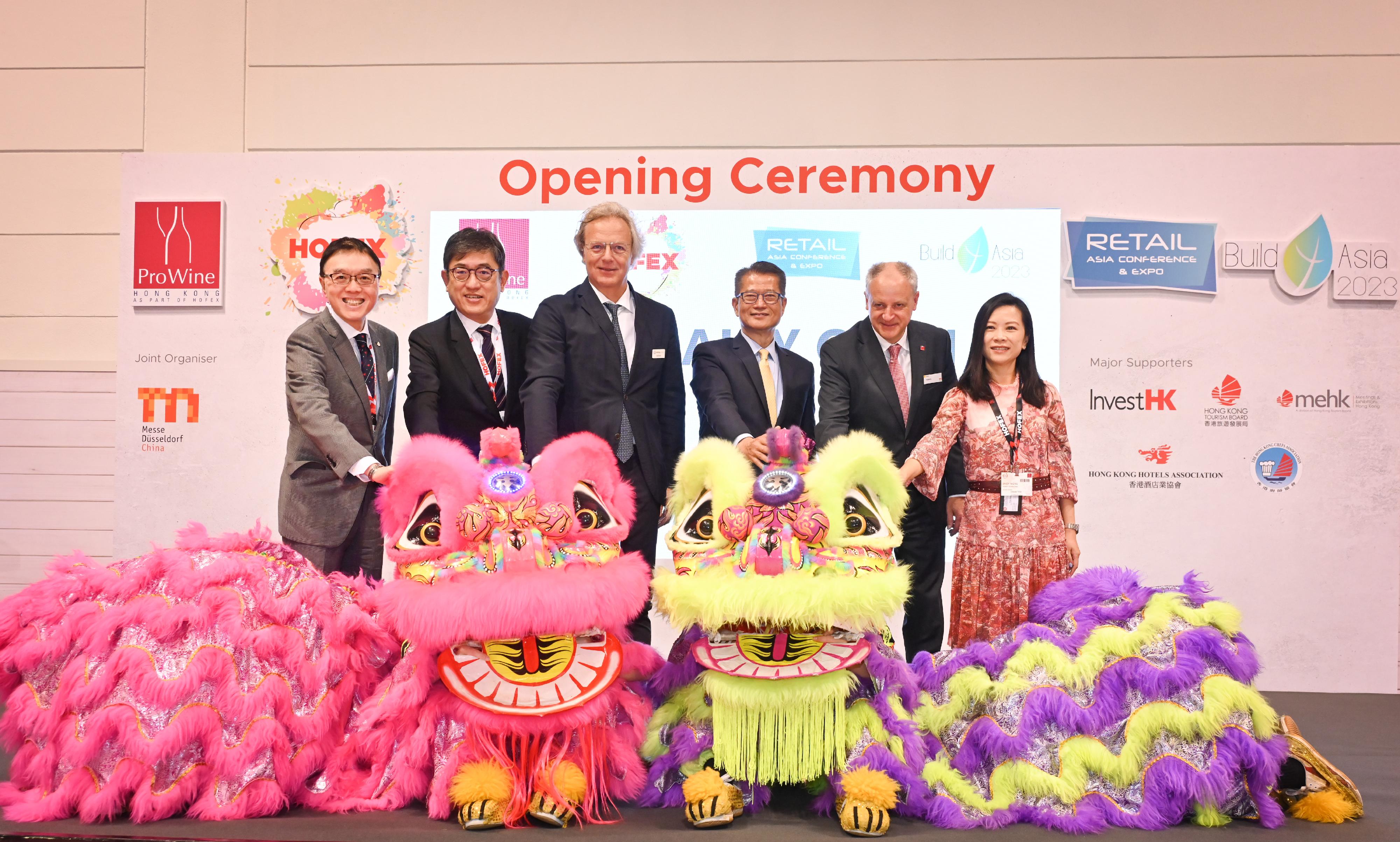 The Financial Secretary, Mr Paul Chan, attended the joint opening ceremony of HOFEX, ProWine Hong Kong @ HOFEX, the Retail Asia Conference & Expo, Build4Asia 2023 and the Hong Kong International Culinary Classic today (May 10). Photo shows (from second left) the Executive Director of the Hong Kong Tourism Board, Mr Dane Cheng; the Senior Vice President of Informa Markets in Asia, Mr David Bondi; Mr Chan, and other guests officiating at the opening ceremony.