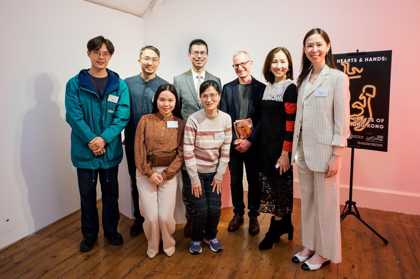 The Hong Kong Economic and Trade Office, London (London ETO), supported Crafts on Peel, a charitable organisation in Hong Kong, to join the London Craft Week 2023, bringing the "Hearts & Hands: Crafts of Hong Kong" exhibition to London. Photo shows the Director-General of London ETO, Mr Gilford Law (back row, third left); Crafts on Peel's founder, Ms Yama Chan (back row, second left); London Craft Week's Chairman and Founder, Mr Guy Salter (back row, third right); Crafts on Peel's Creative Director, Ms Penelope Luk (back row, first right); and participating artisans from Hong Kong at a reception of the exhibition on May 9 (London time).